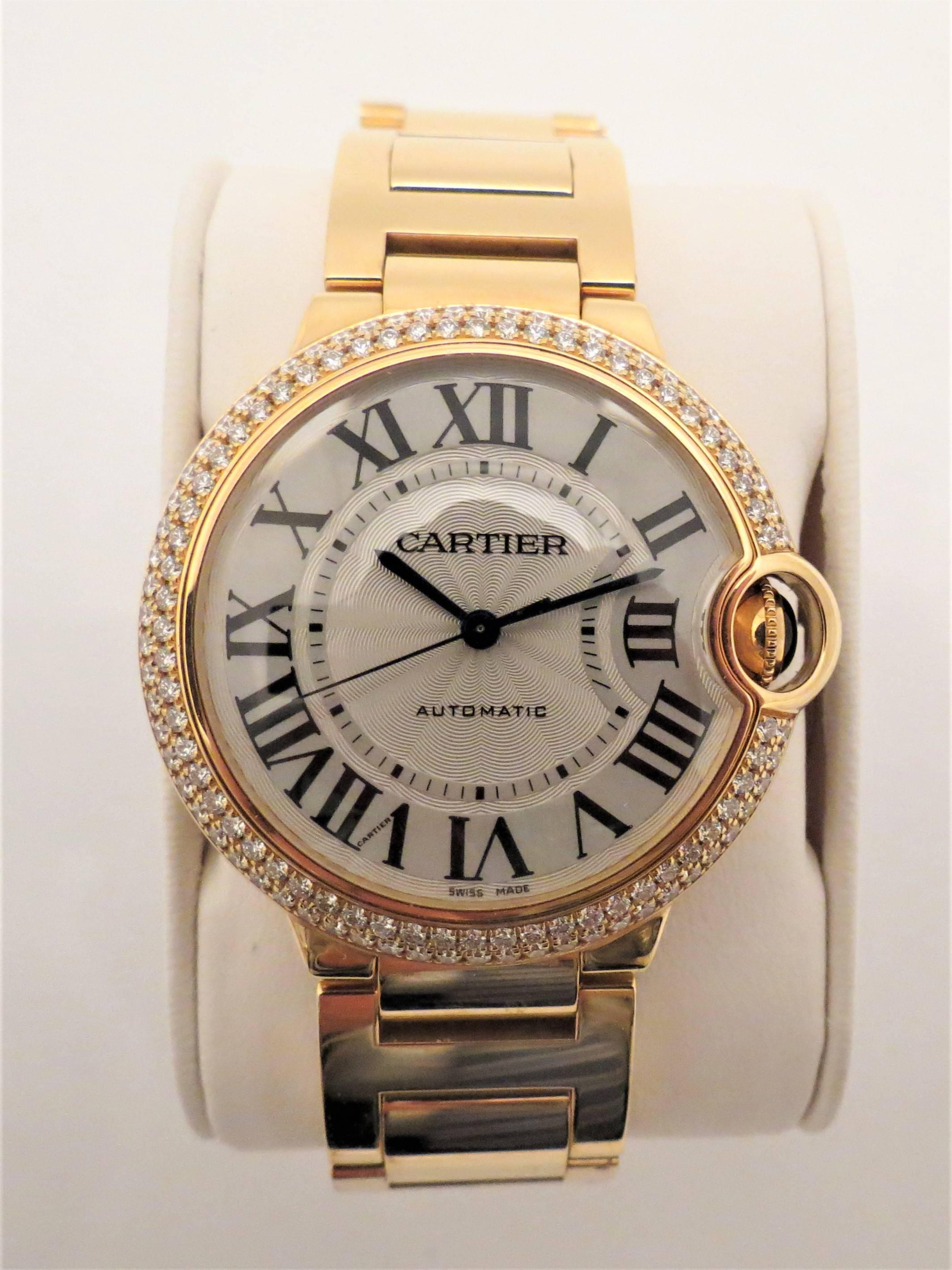 Brand new, never worn, 18K yellow gold diamond Cartier Ballon Bleu bracelet watch, case size 36mm, silver dial, black Roman numerals, automatic movement. 
Model number: WE900423
Serial number: 3002127364RX
Two year warranty
Current retail $50,000
