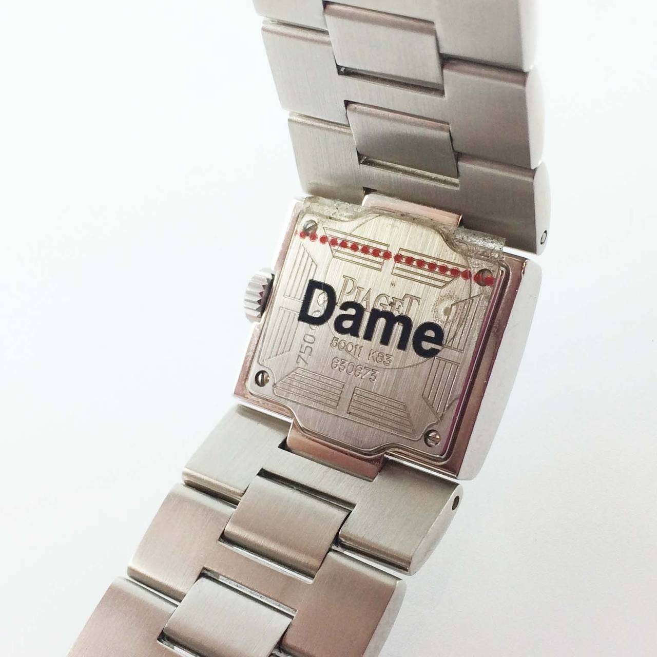 New Piaget 18K white gold lady's diamond Square Dancer bracelet watch, quartz movement, two row diamond case and 4 diamond markers and black stick markers on silvered dial.

New in box
2 year Cartier warranty