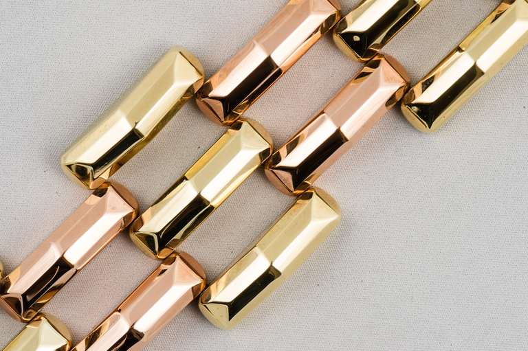 Retro 14K yellow and rose gold bracelet, high polish, flexible, triangular geometric design, 1.25 inches wide and 7 inches long.