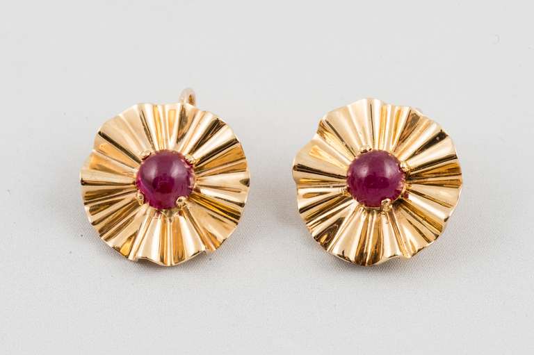 Signed TH&M (very faint on clips), 18K Yellow Gold Ear Clips, bright finish fluted design, prong set with two round cabochon rubies measuring 6.85 -7mm each.