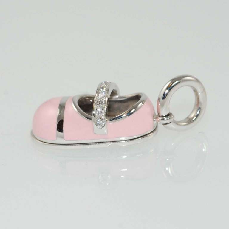 Aaron Basha 18K white gold, pink enamel baby shoe charm with diamond strap, pave set with 9 full cut round diamonds weighing .07 carats, G color, VS clarity, suspended from 18K white gold bale.