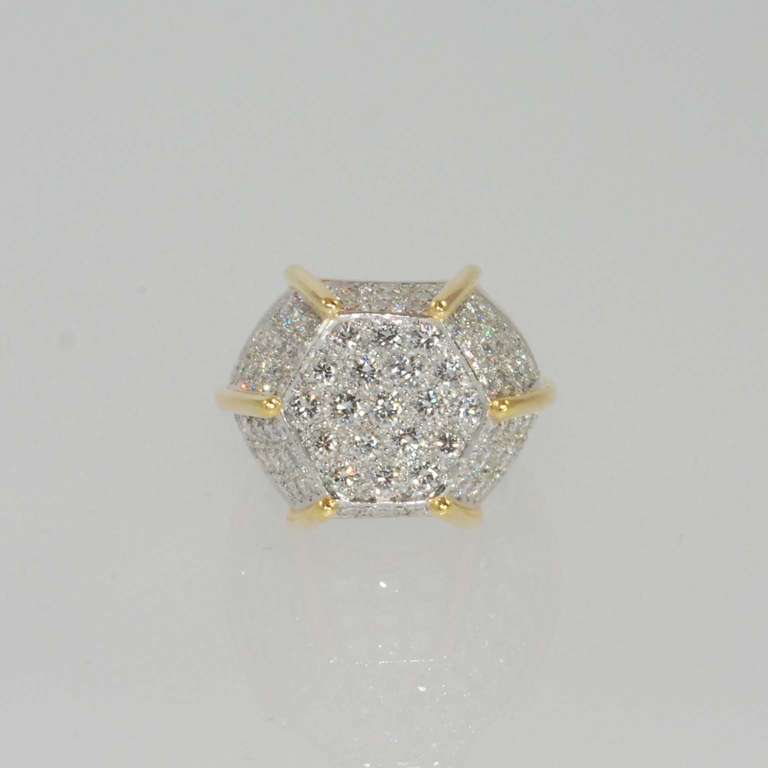 Platinum and 18K yellow gold hexagon design ring by Montreaux pave set with 105 full cut round diamonds weighing 6.50 carats, D, E color, VVS clarity.