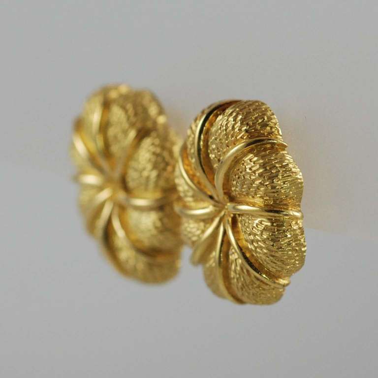 Tiffany 18K yellow gold ear clips, textured and bright gold finish.