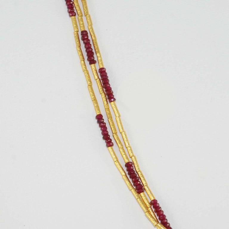 Gurhan, 24K yellow gold, 3 strand faceted ruby necklace, rubies weighing 11.06 carats, Rain Design, 18 inches long.