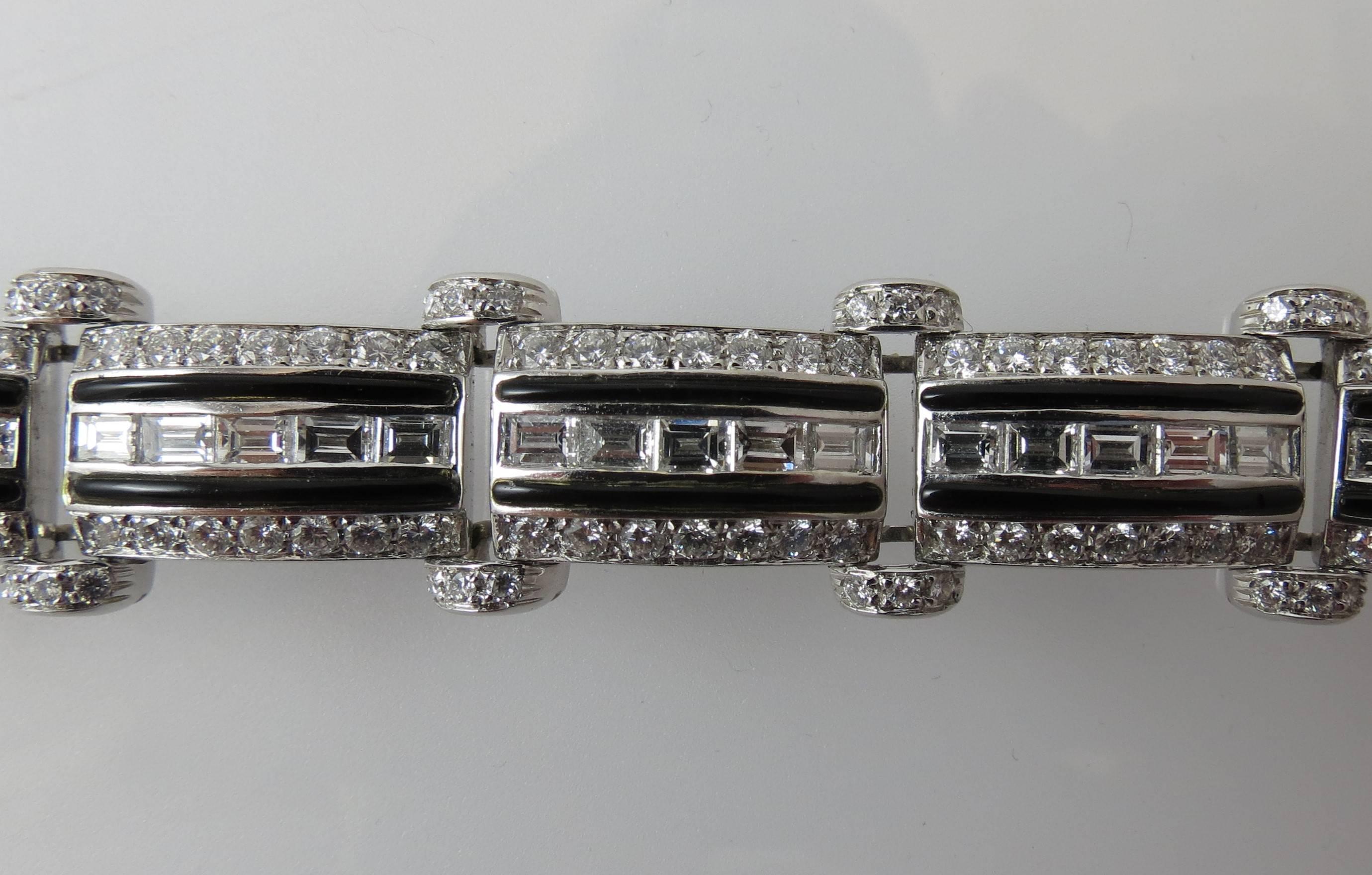 Picchiotti 18K white gold diamond and black onyx bracelet with 11 flexible links and 220 round diamonds weighing 3.82cts and 55 baguette diamonds weighing 5.84cts, G color, VS clarity, 7.75 inches long and .50 inches wide.
