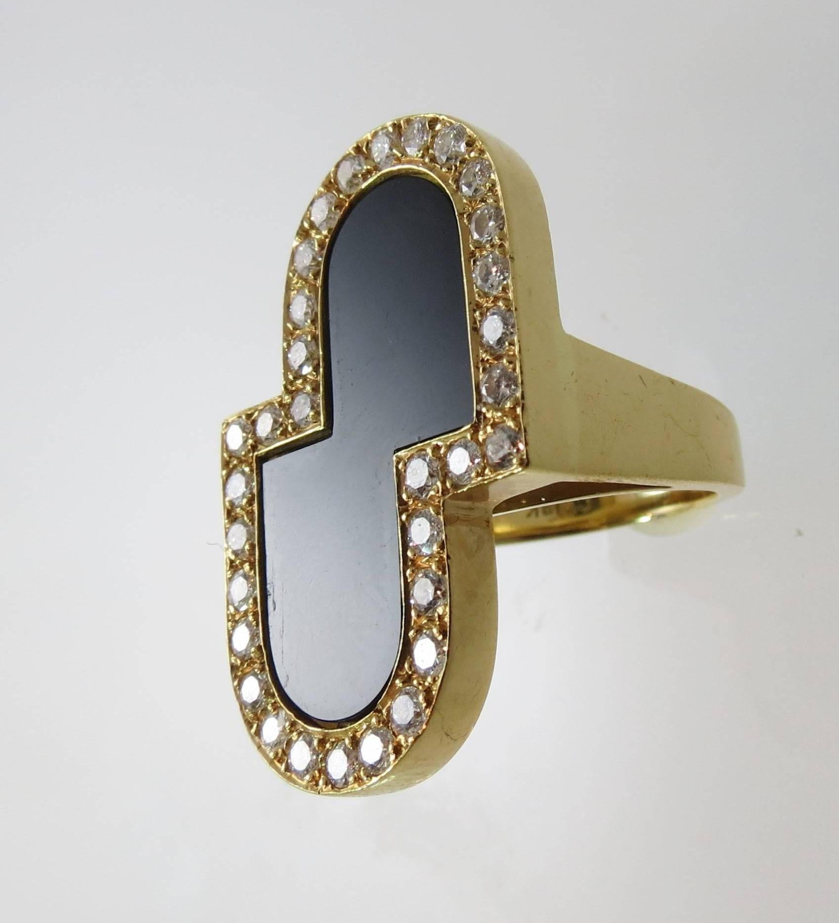 14K yellow gold ring with black onyx, surrounded by 32 round diamonds weighing approximately 1.12ct, G color, VS clarity
Size 5.5, may be sized 