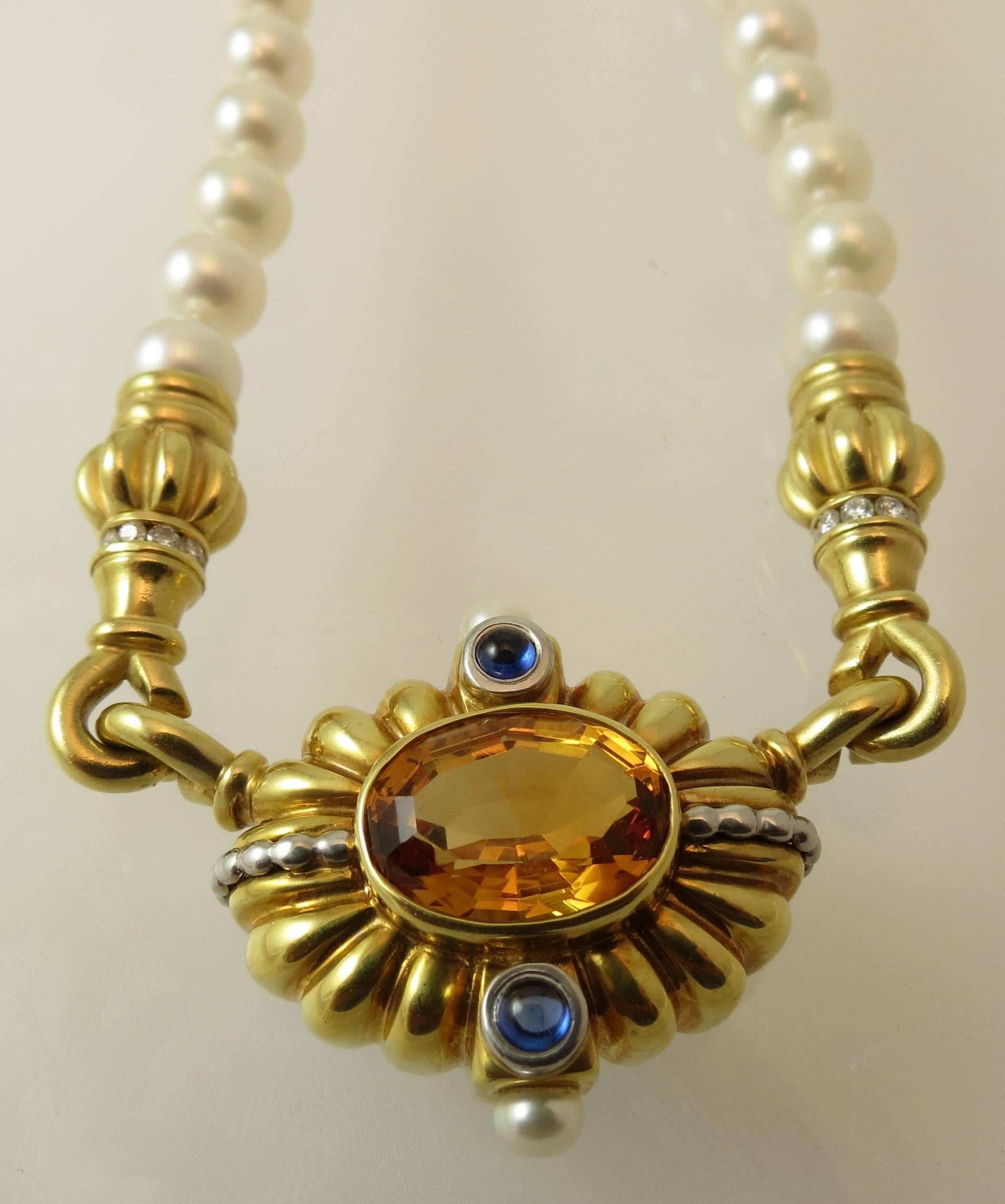 Spectacular Steven Lagos 18K  yellow gold diamond ( 18 round diamonds weighing approximately .72cts, FG color, VS clarity) faceted citrine ( 14mm by 10mm) and cabochon iolite (2 approximately weighing 2.8mm) pendant attached to 55 7mm cultured