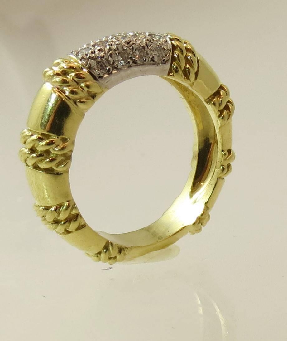 Cassis 18K yellow gold band ring set with 18 round diamonds weighing approximately .27cts FG color, VS2 clarity
Finger size 6, may be sized
Current retail is $2750