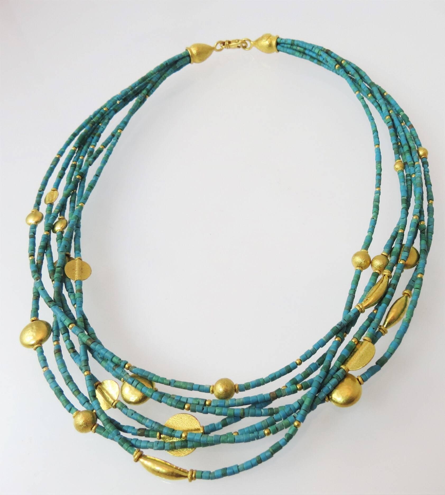 Fabulous 24K yellow gold and turquoise seven strand bead necklace, with multi-shape 24K yellow gold elements and 24K yellow gold clasp.  18 inches in length.