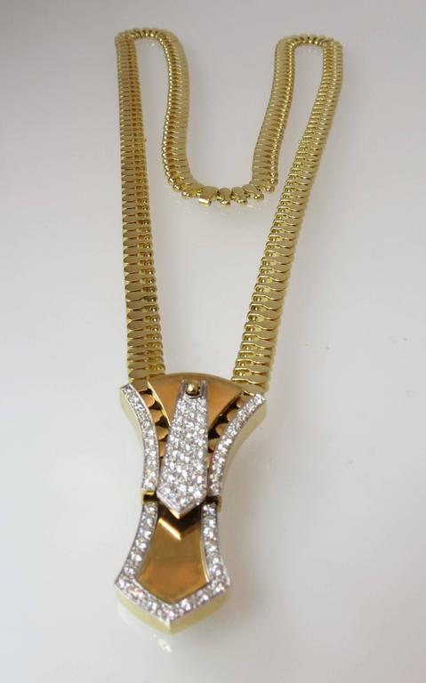 Lot - JEWELRY: 18K Diamond zipper necklace, adjustable zipper design,  stamped and tested “750” 18K yellow gold, working zipper allows the necklace  to be adjusted, set with forty-seven round brilliant cut diamonds