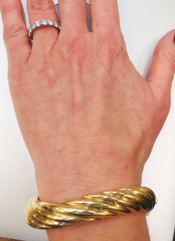 Contemporary 14K Yellow Gold Twist Style Bangle Bracelet at 1stDibs