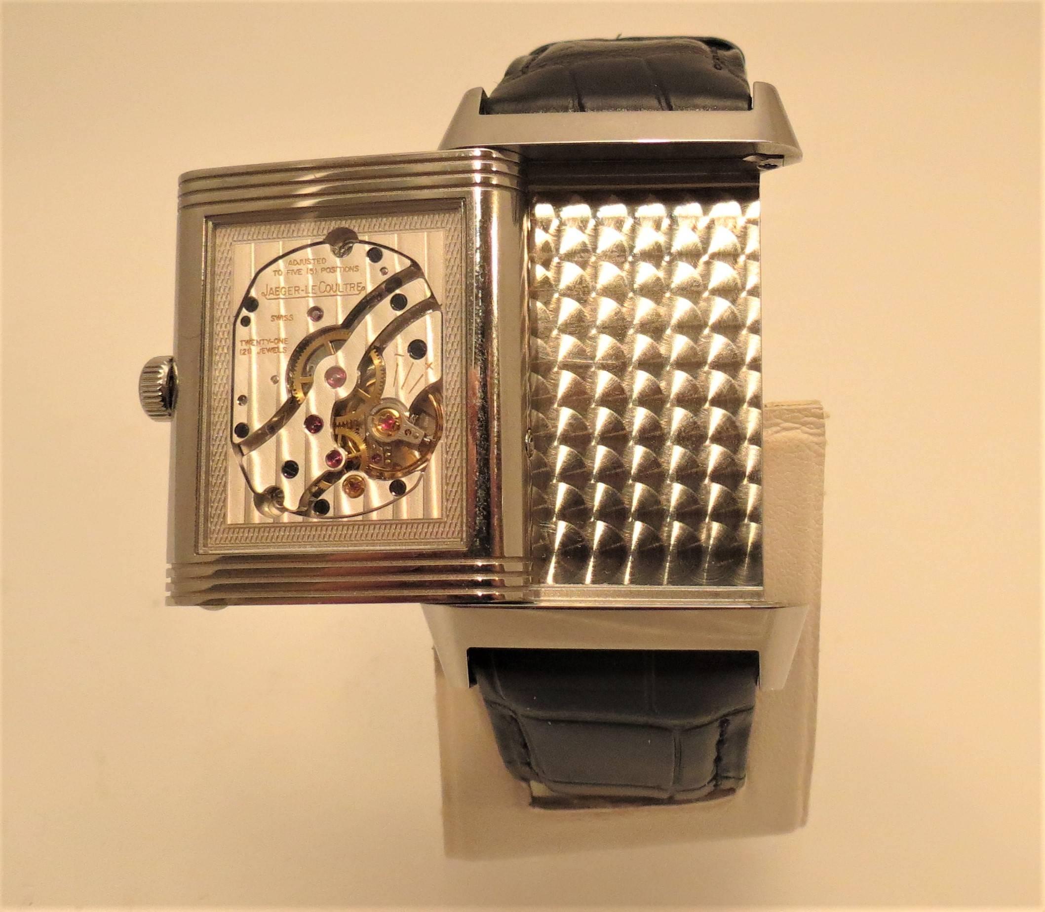 Brand new, Never Worn Jaeger LeCoultre stainless steel Grand Reverso watch, with deployant buckle, manual wind, 45 hour power reserve, moon phase, day and date, case length 48.5 mm and case width 29.5 mm, black alligator strap.

Brand new, never