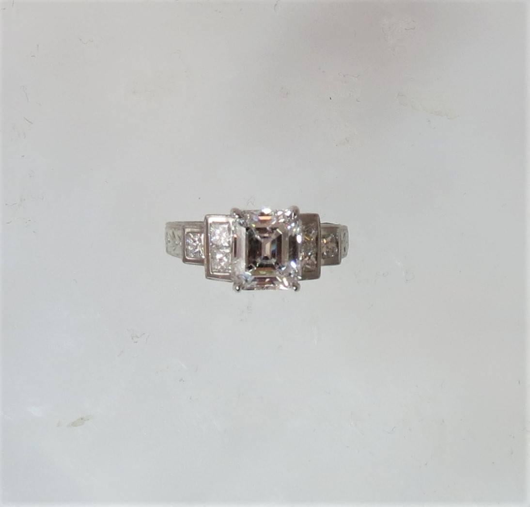 GIA Certified Emerald cut diamond, weighing 2.25ct , F color, VVS2 clarity, with 6 princess cut diamonds weighing .61cts, set in engraved Varna platinum and 18K yellow gold mounting
Finger size 6, may be sized
GIA report number 12868544