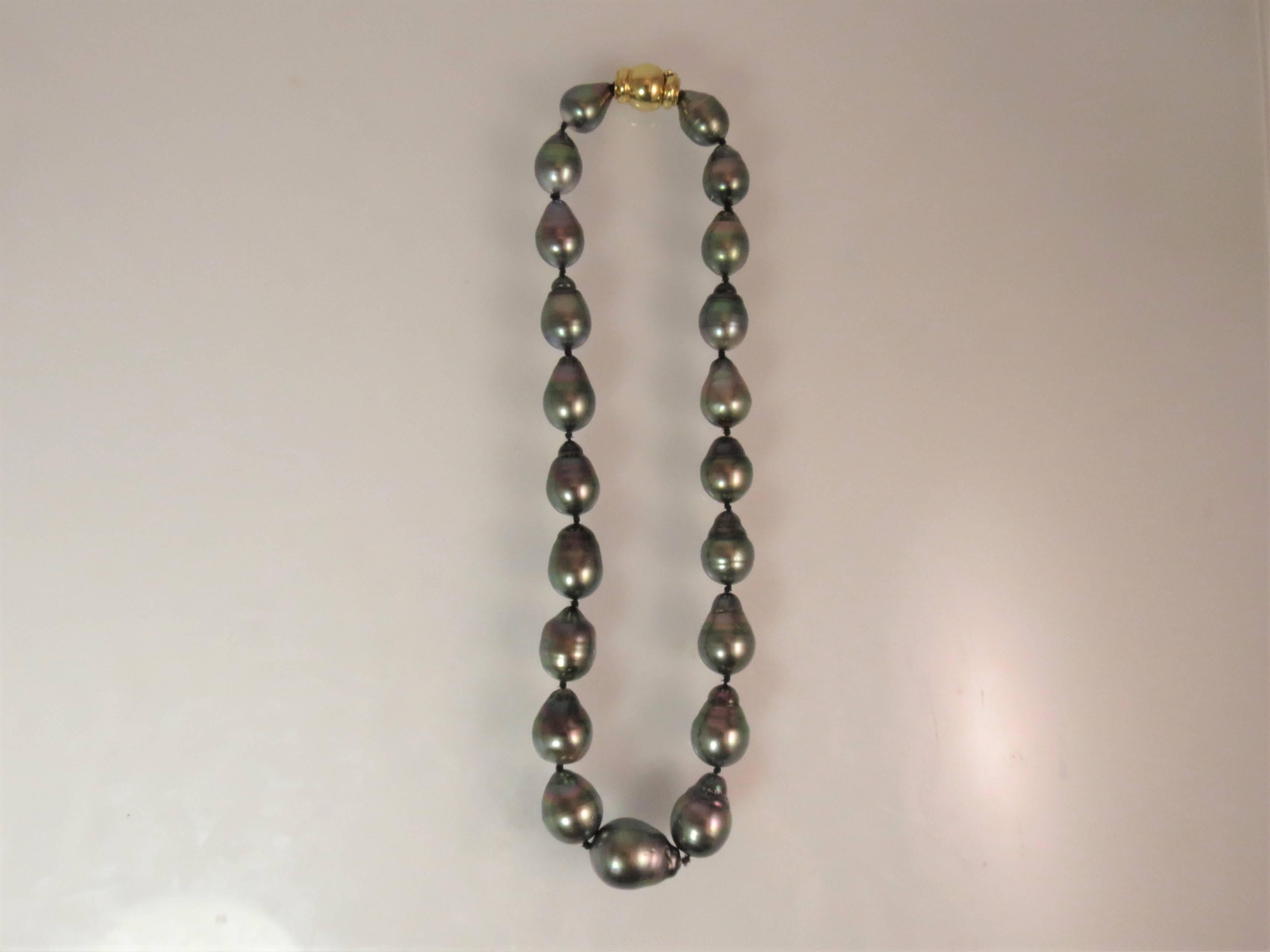 Baroque Tahitian pearl necklace with 18K yellow gold clasp, 21 pearls, measuring 15.95 x 11.50mm, 15 inches long, with 18K yellow gold clasp
