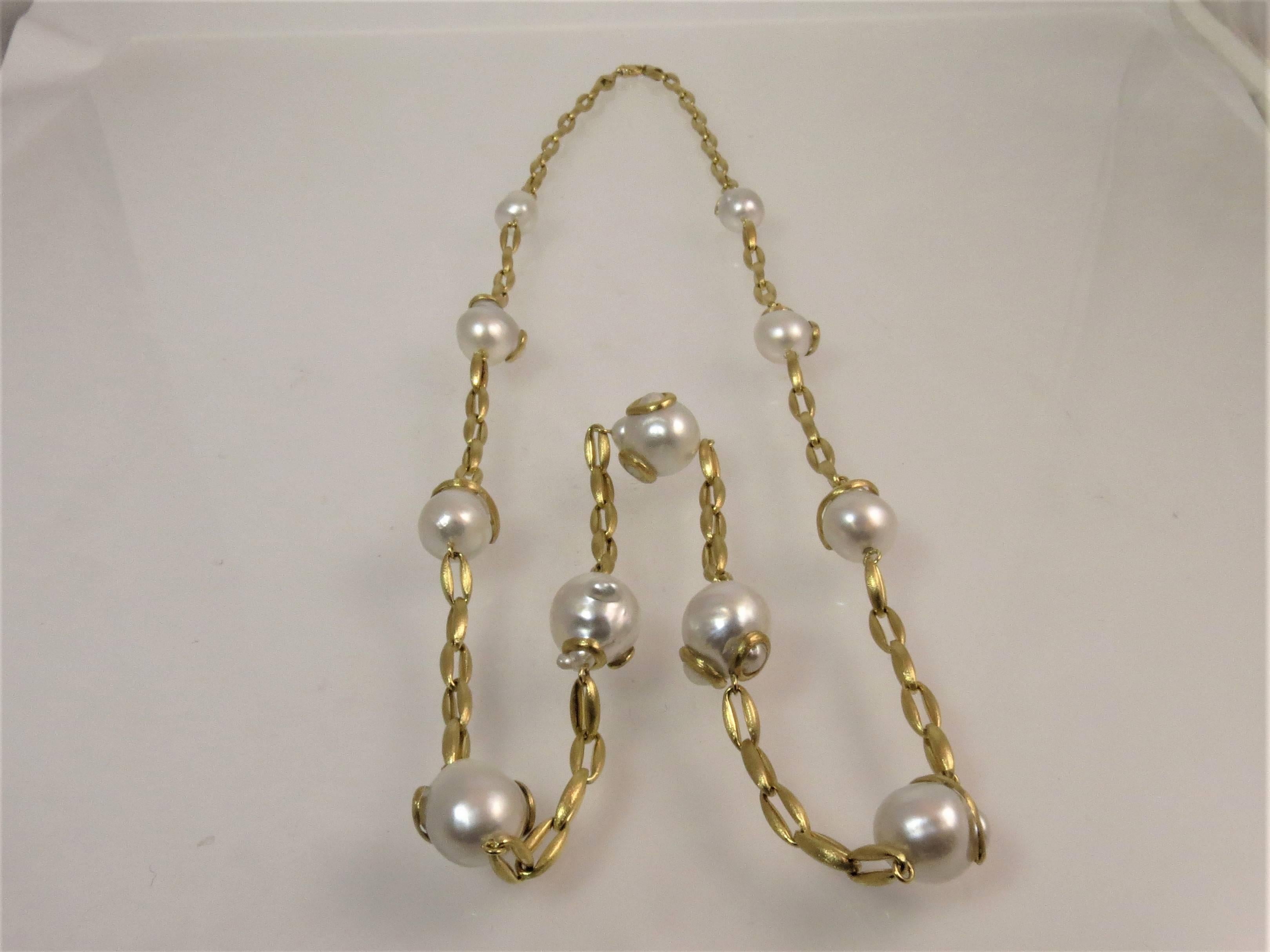 YVEL 18K brushed yellow gold 36 inch link necklace, with 11 Baroque South Sea pearls. Pearls measure 20mmx13mm. 