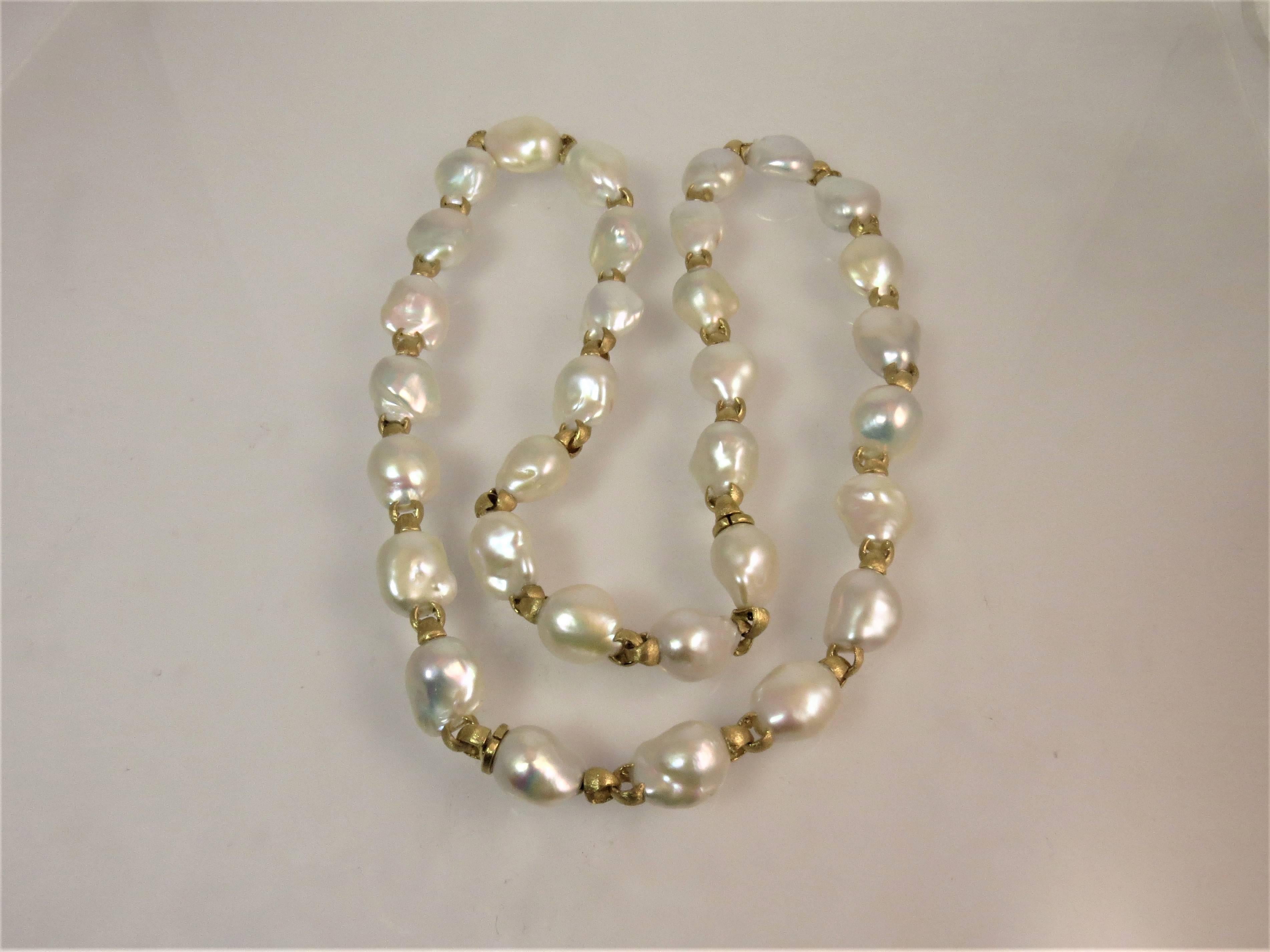 Yvel 18K brushed yellow gold link necklace, 32 inches long with 32 fresh water Baroque pearls, pearl size 20mmX15mm.