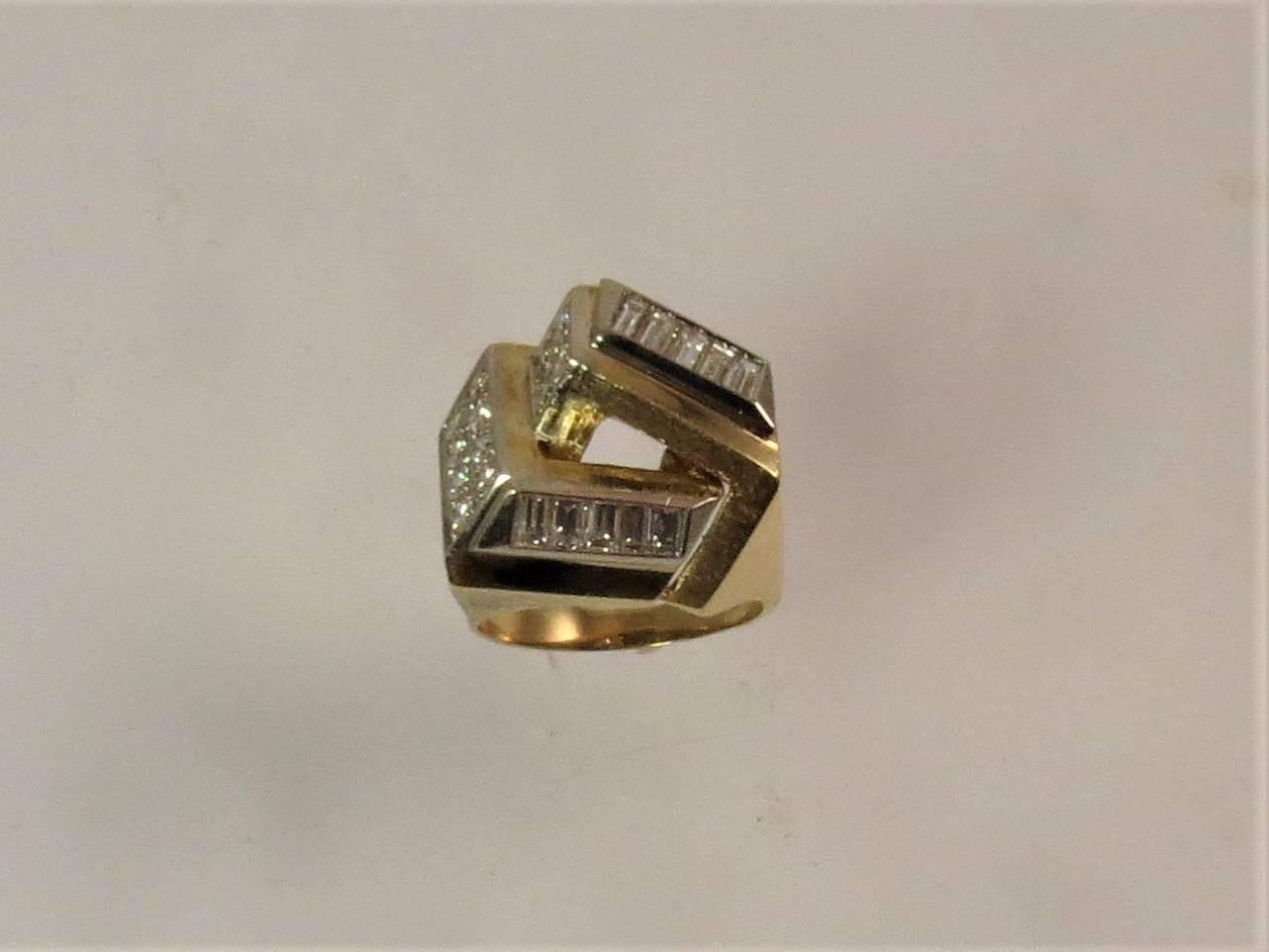  Contemporary 18K yellow gold ring, set with 10 baguette diamonds weighing .75cts, and 12 round diamonds weighing .40cts, GH color, VS clarity
Finger 7, may be sized