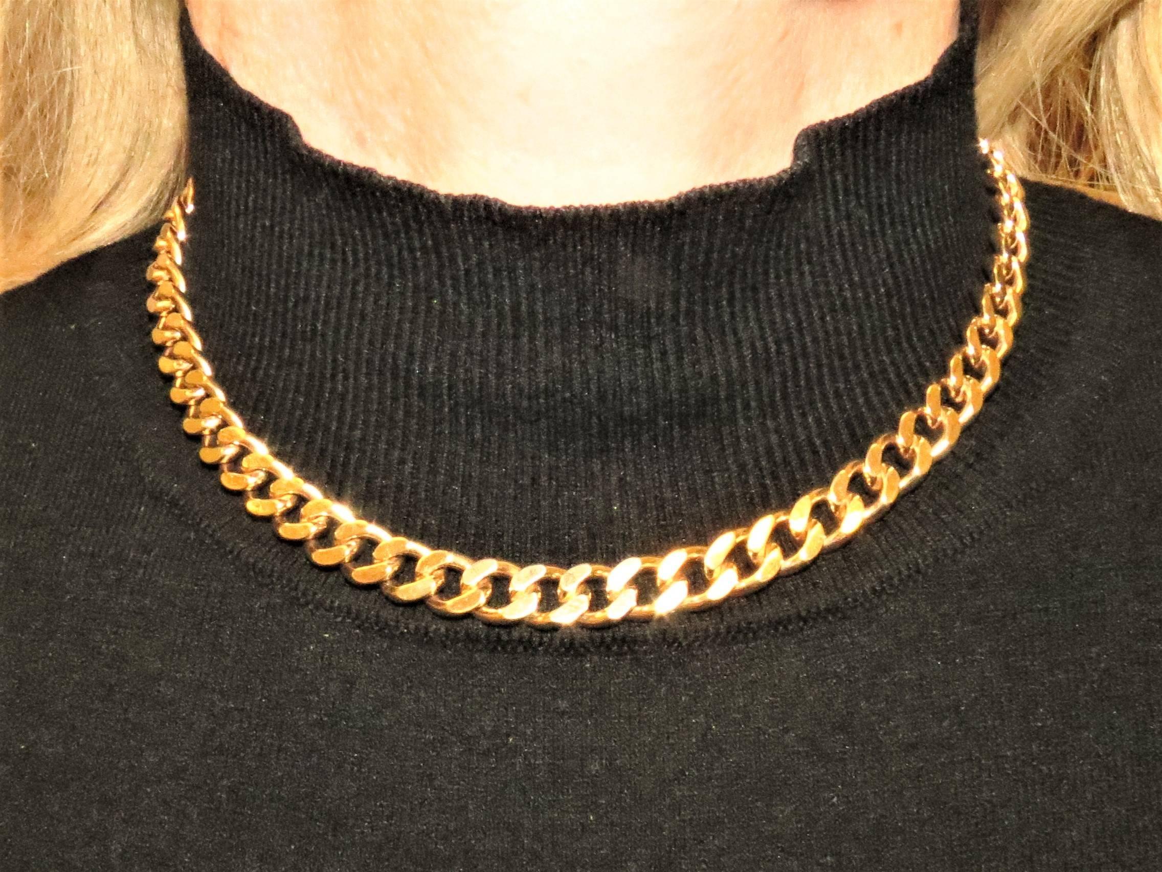 14K yellow gold curb link necklace, 15 inches long and .25 inches wide.