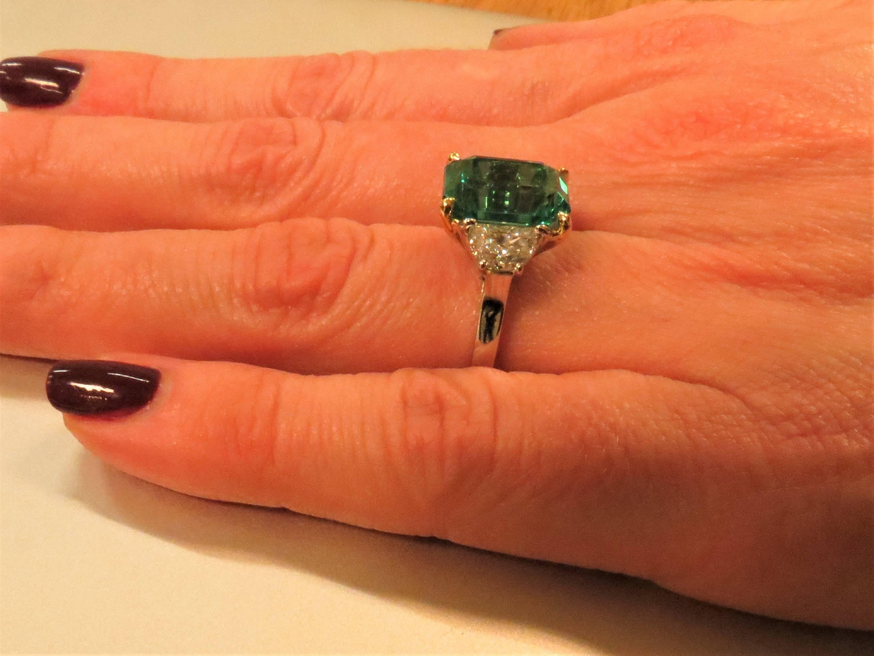 Contemporary Platinum and 18 Karat Yellow Gold Emerald and Half Moon Diamond Ring