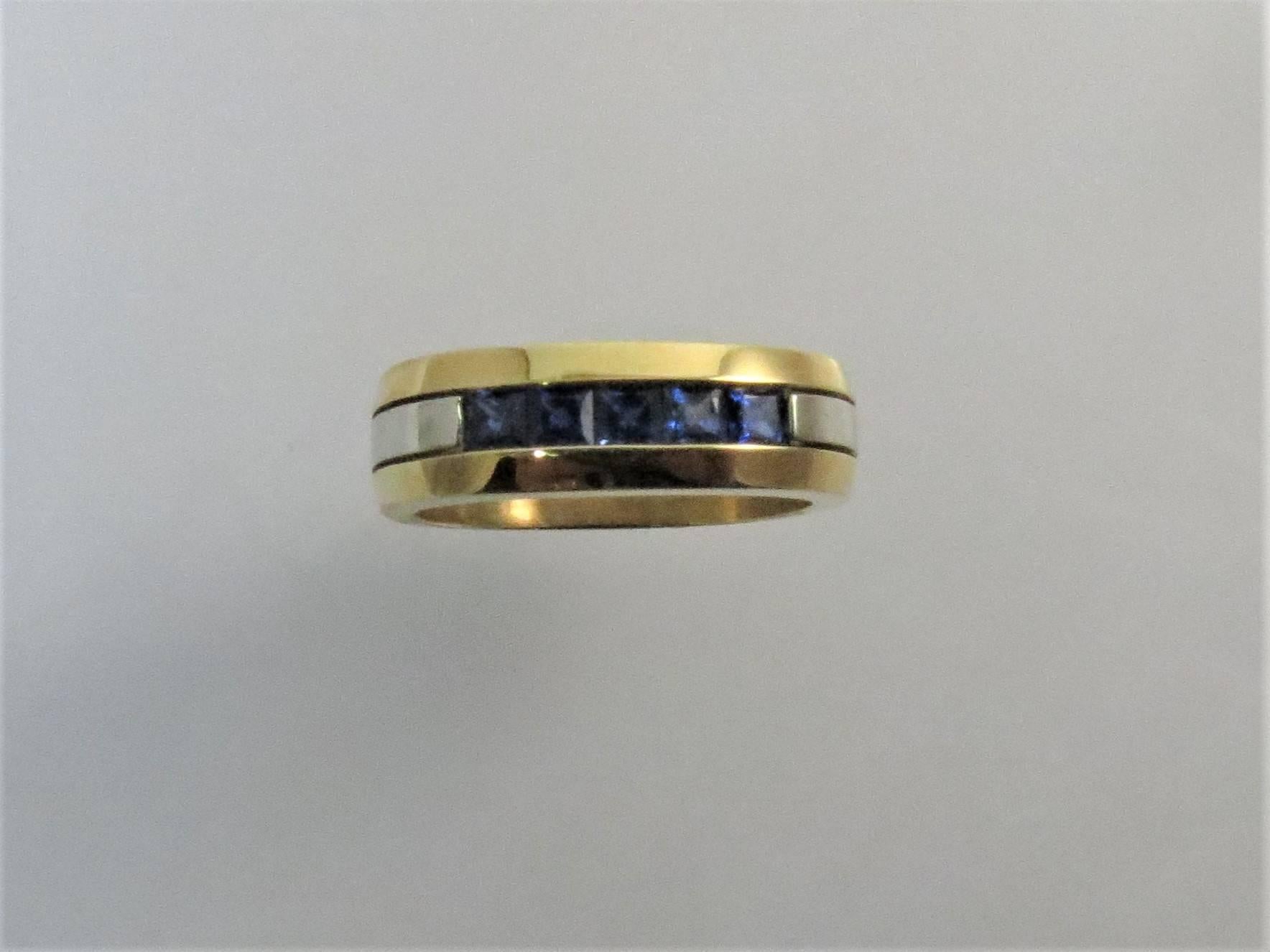 Gents 18K yellow gold and 18K white gold band ring, set with 5 square cut blue sapphires weighing .88cts total. 
Size 9.5, may be sized.