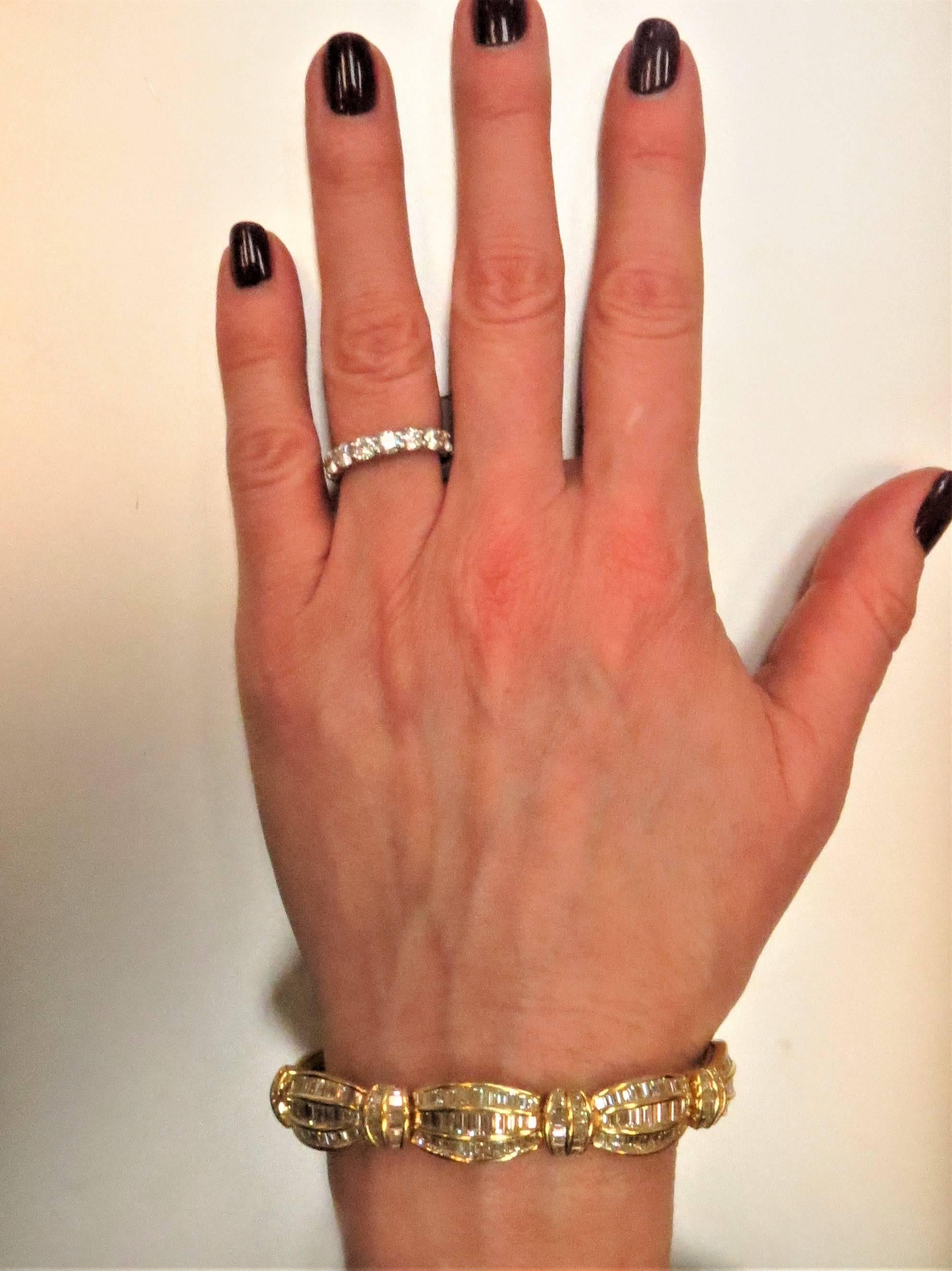 Unique Picchiotti 18K yellow gold bracelet, set with 315 baguette diamonds weighing 16.82cts, channel set, F-G color, VS clarity