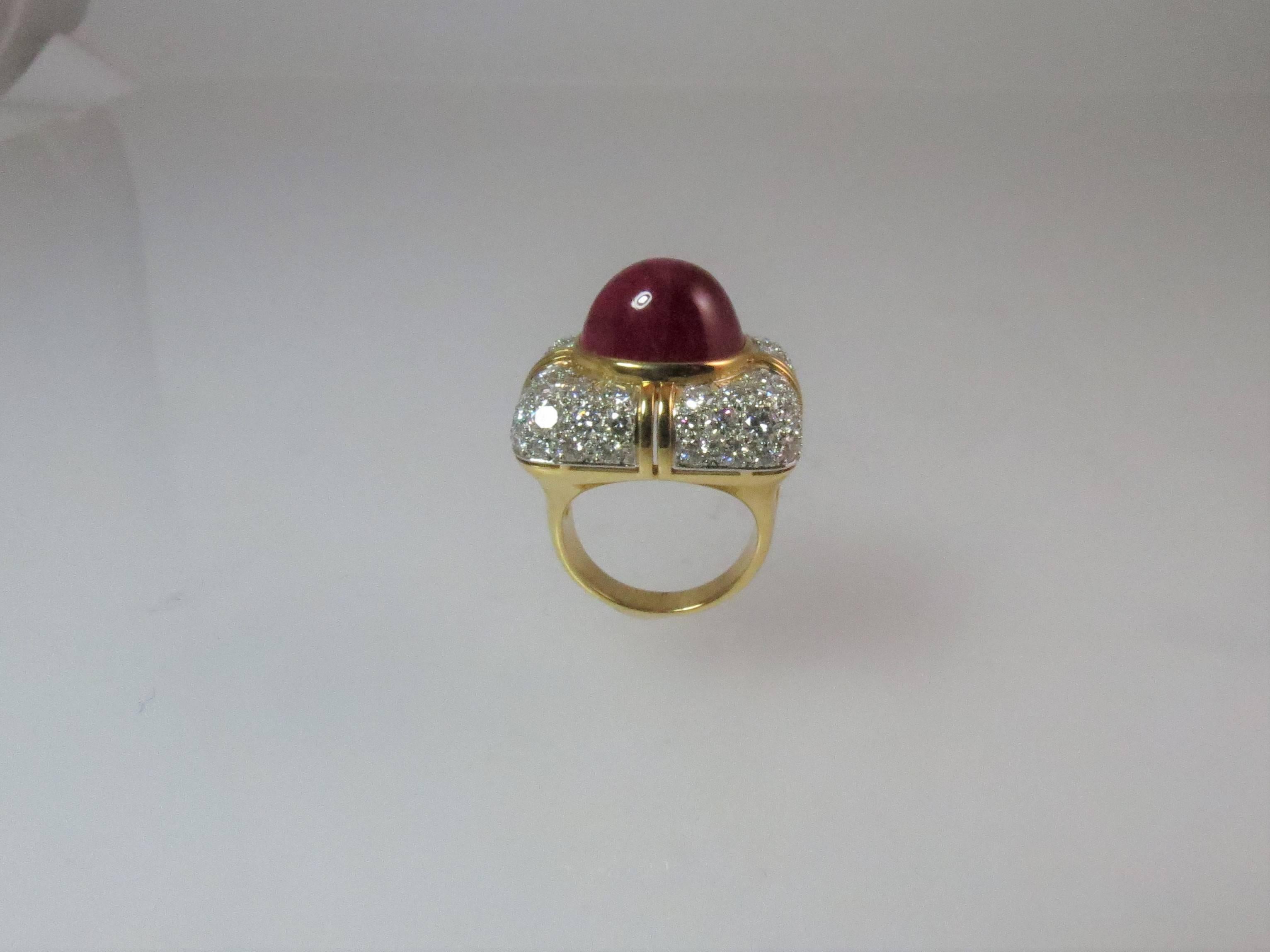 Montreaux, 18K yellow gold and platinum ring, set with one cabochon ruby weighing 15.80 carats, measuring 13.60mm x 11.95mm and 72 full cut round diamonds weighing 3.66cts, D-E color, VVS.
Finger size 6.25, may be sized 