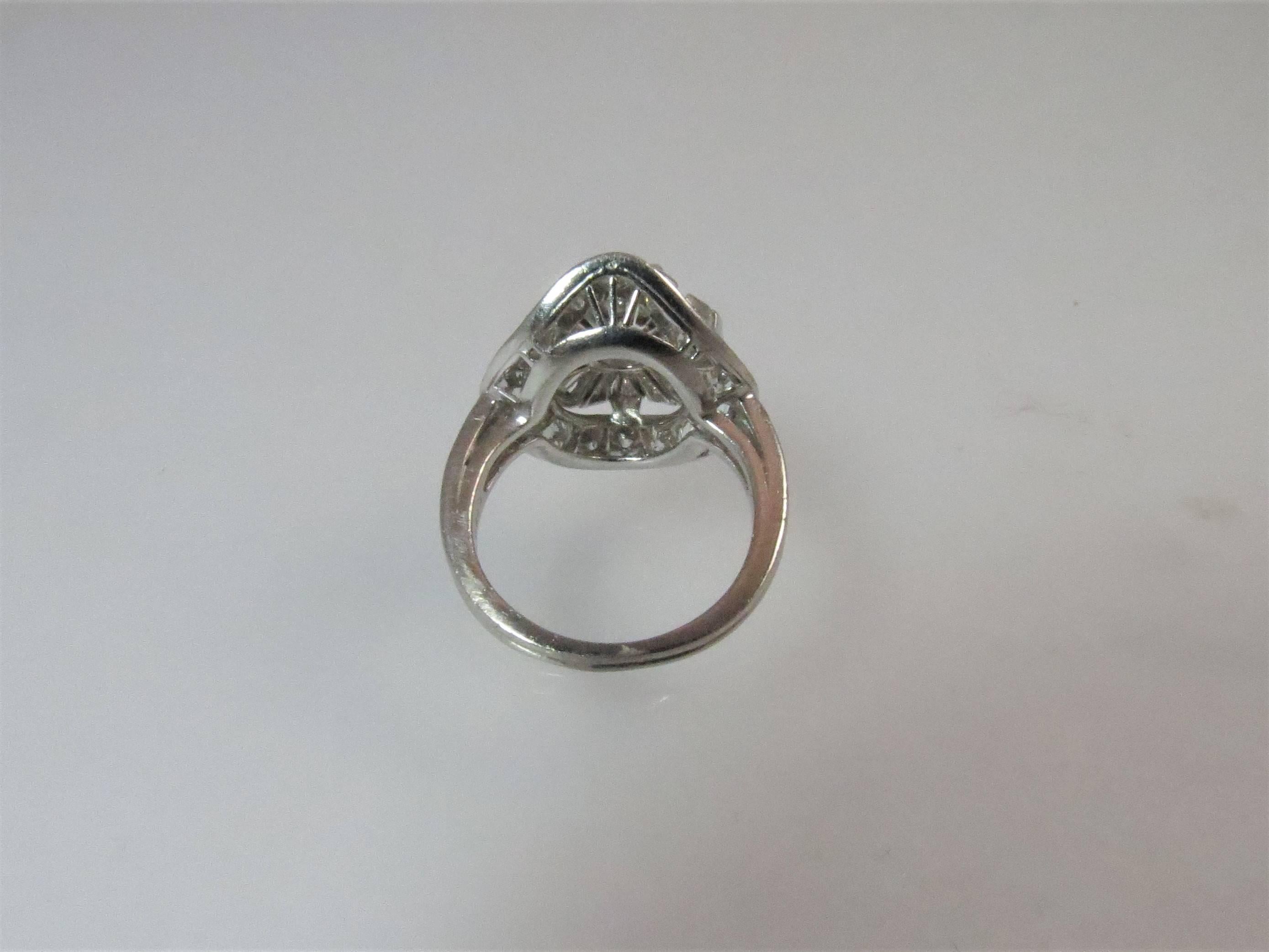 Contemporary Platinum Round Diamond and Tapered Baguette Cocktail Ring