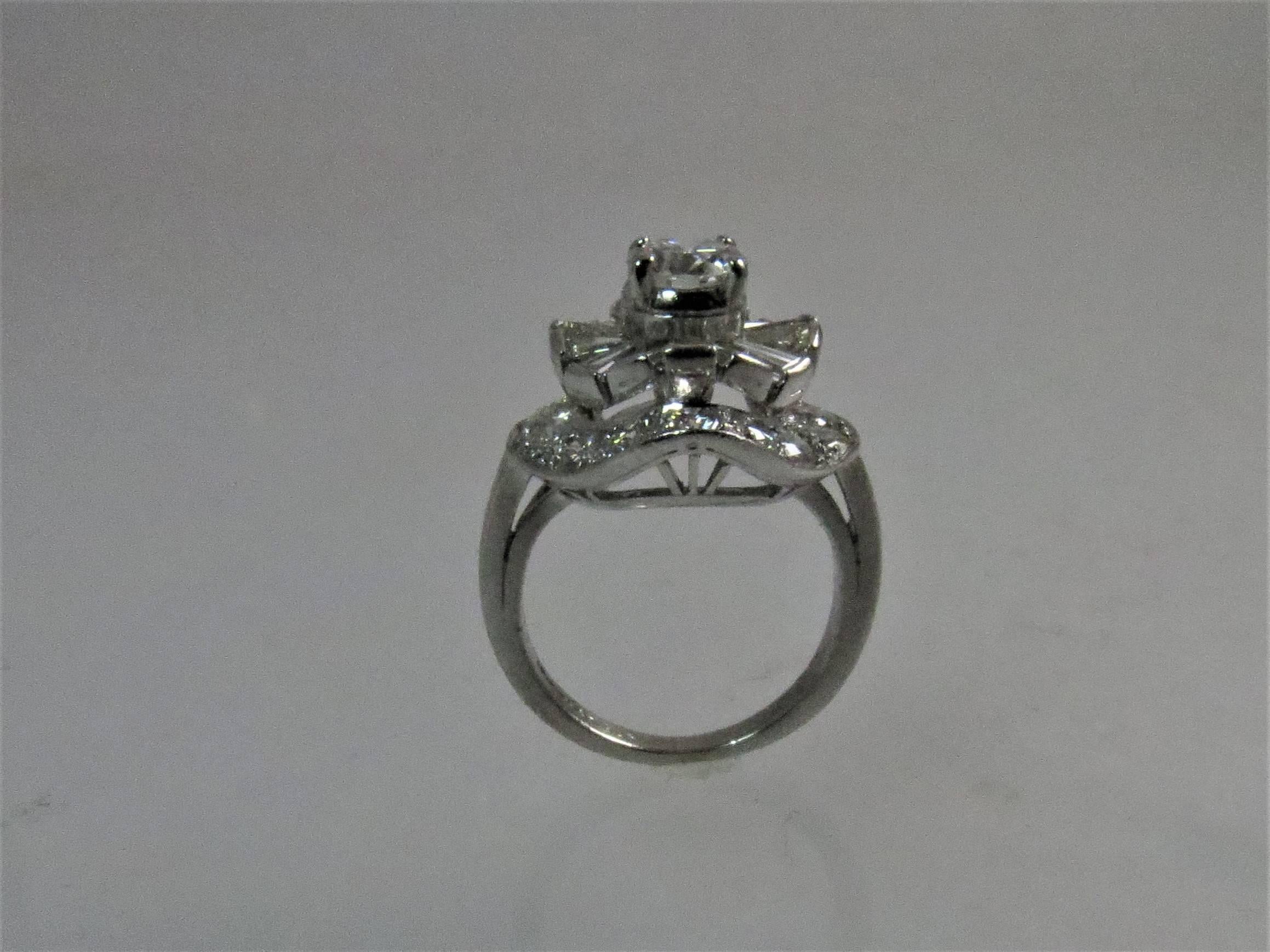 Platinum Round Diamond and Tapered Baguette Cocktail Ring In Excellent Condition In Chicago, IL