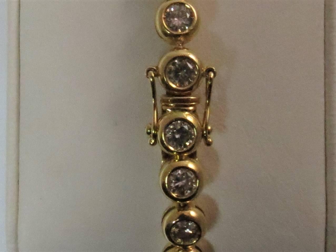 18 Karat Yellow Gold Bezel Set Diamond Tennis Bracelet In Excellent Condition In Chicago, IL