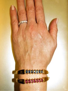 Pair of 18 Karat Yellow Gold Sapphire and Ruby Hinged Bangle Bracelets