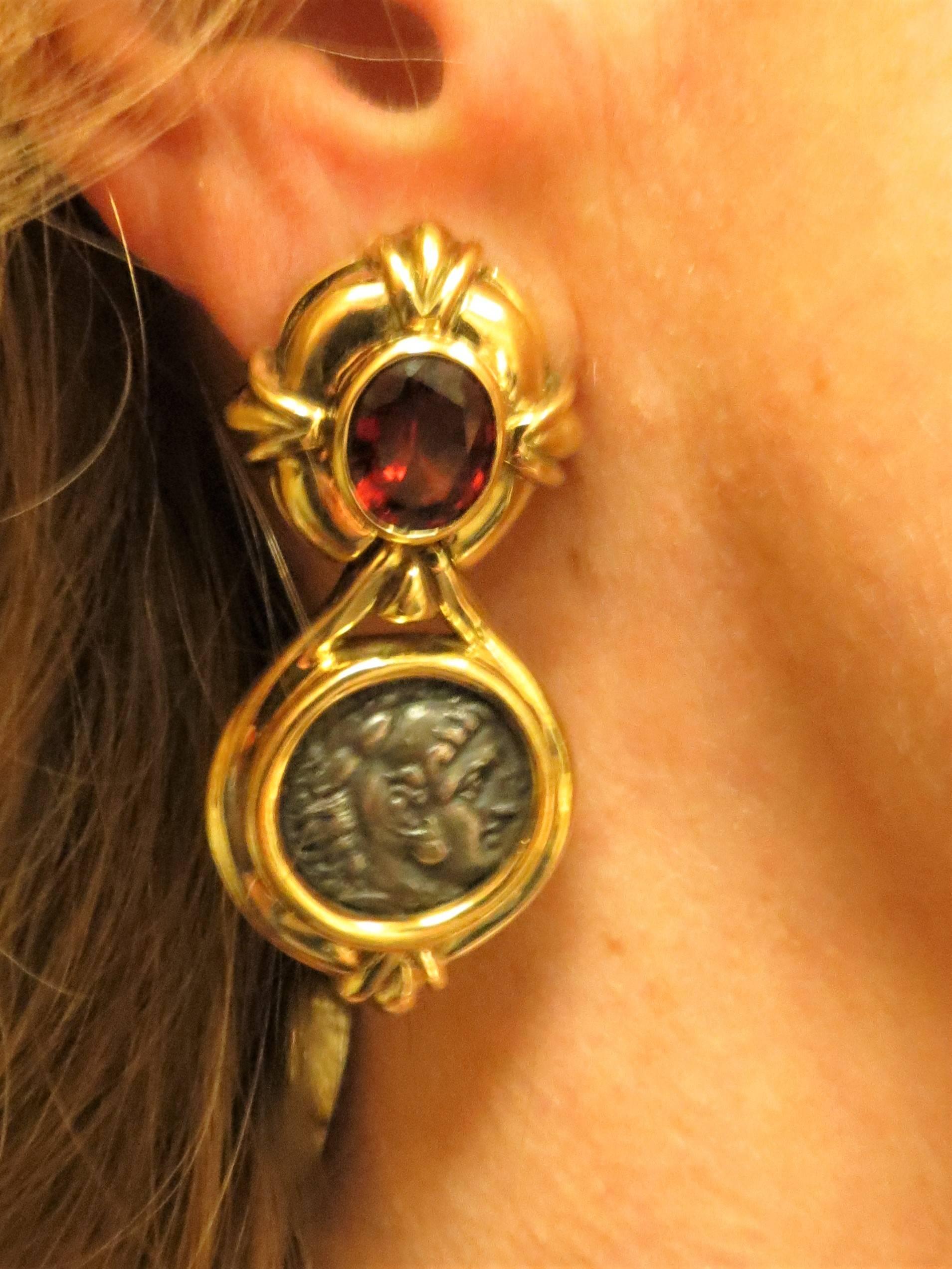 Susan Berman 18K yellow gold drop earrings with bezel set garnets and ancient Roman coins