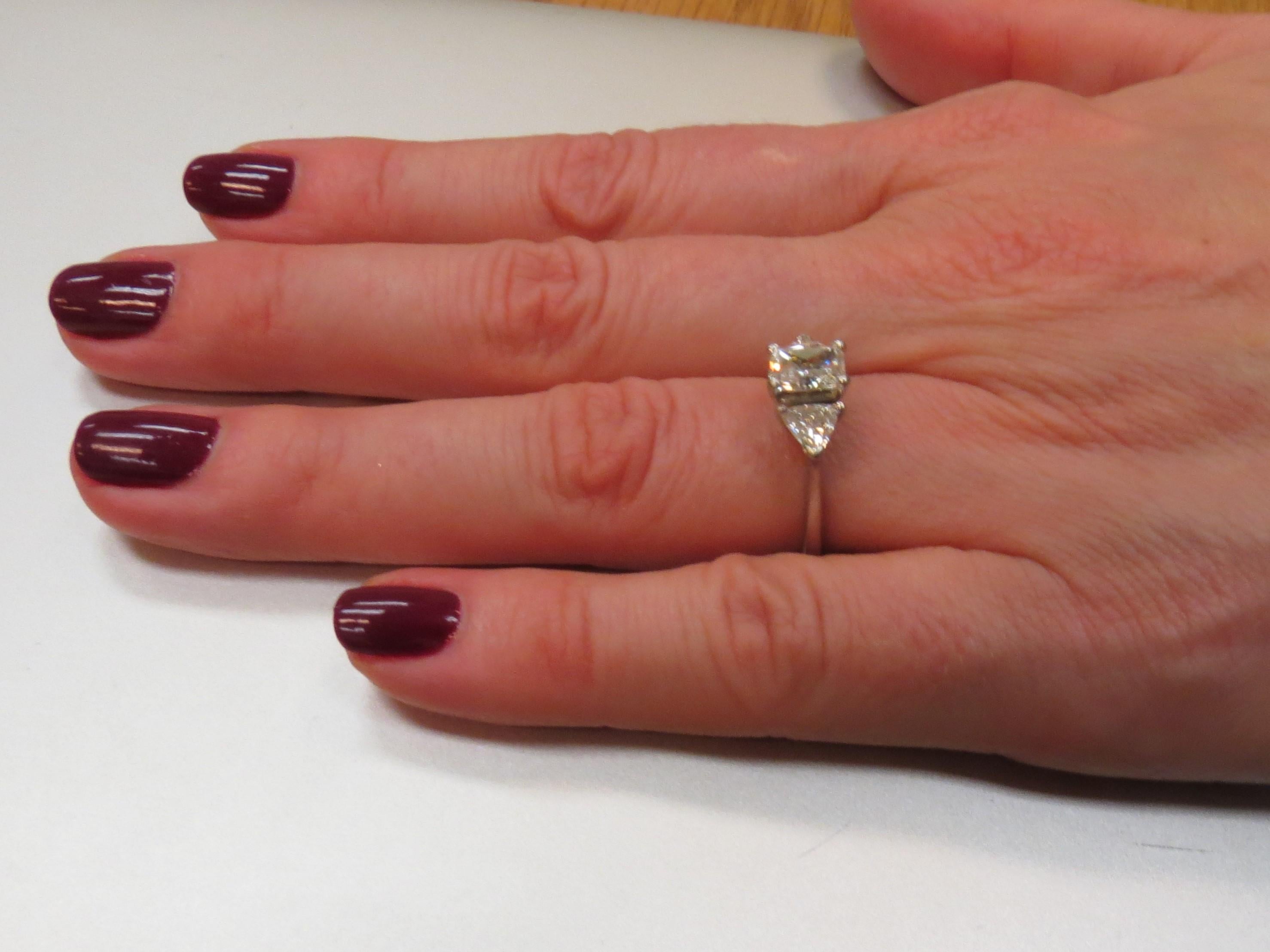 Contemporary Platinum Ring with Radiant Cut Diamond and Diamond Trilliants