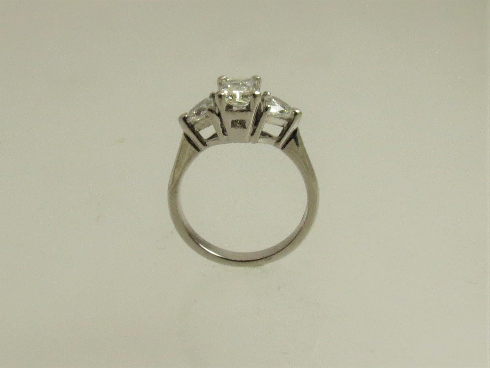 Platinum Ring with Radiant Cut Diamond and Diamond Trilliants In Excellent Condition In Chicago, IL