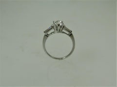 Platinum Engagement Ring Prong Set with Pear Shape Diamond and Baguettes