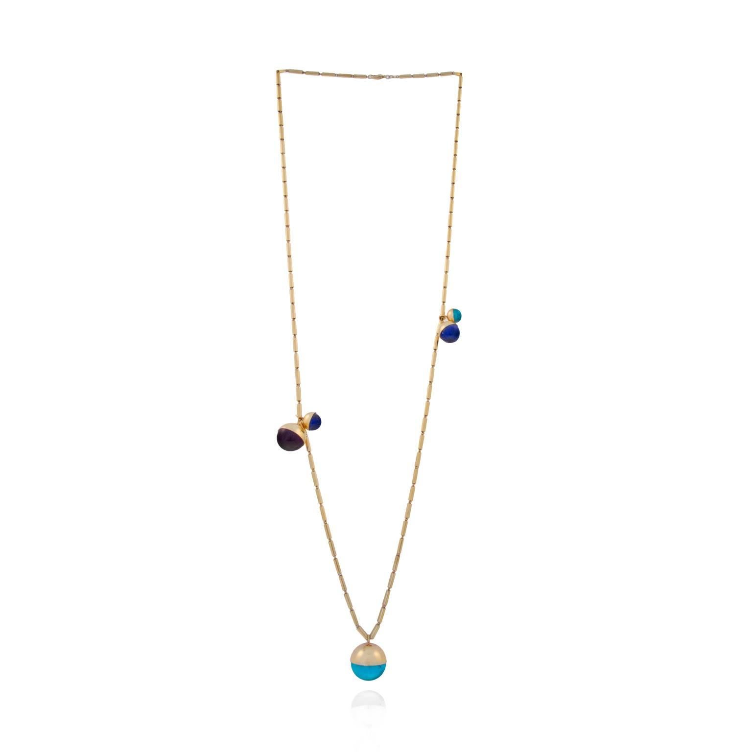 A solar system in miniature, the Five Planets necklace comprises precious spheres in a spectrum of sizes. Lapis Lazuli, turquoise and amethyst orbit move freely around the neck on an 18ct rose gold stick chain, which is 90cm long and 3mm in