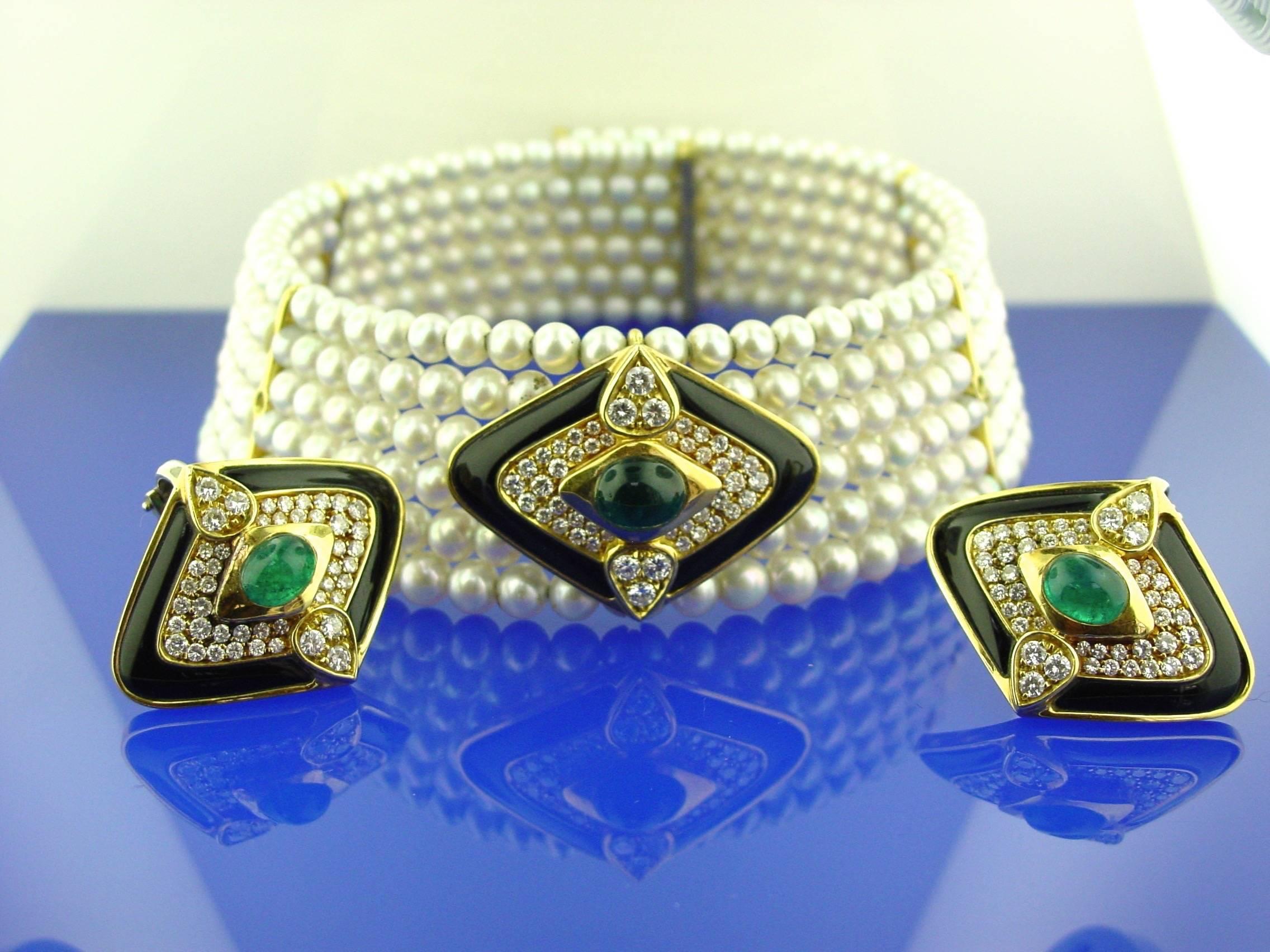 A 18 Karat  Yellow Gold, 6 Row 5.5 mm Cultured Pearl Choker Set With Three Emerald, Diamond and Black Enamel Sections. Two of  the sections may be removed to wear as pierced earrings. Set with approximately 5.50 carats of round brilliant diamonds