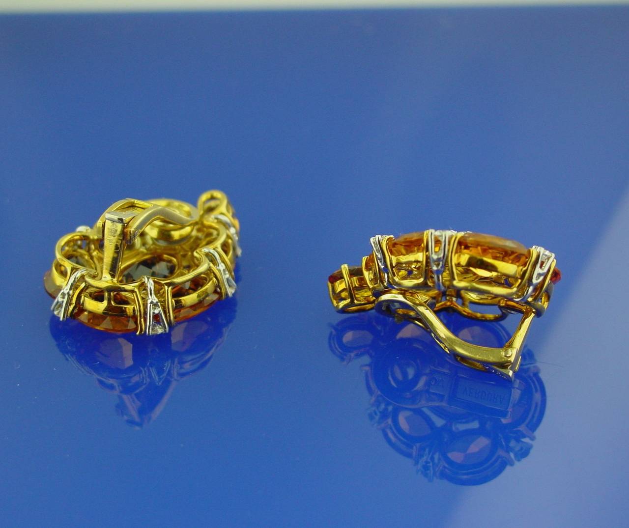 A Pair of 18 Karat Yellow Gold Citrine and Diamond Paisley Earclips, Set with sixteen oval cut citrines and twenty-six round diamonds weighing approximately .75 carats. Signed Verdura with maker's mark.
