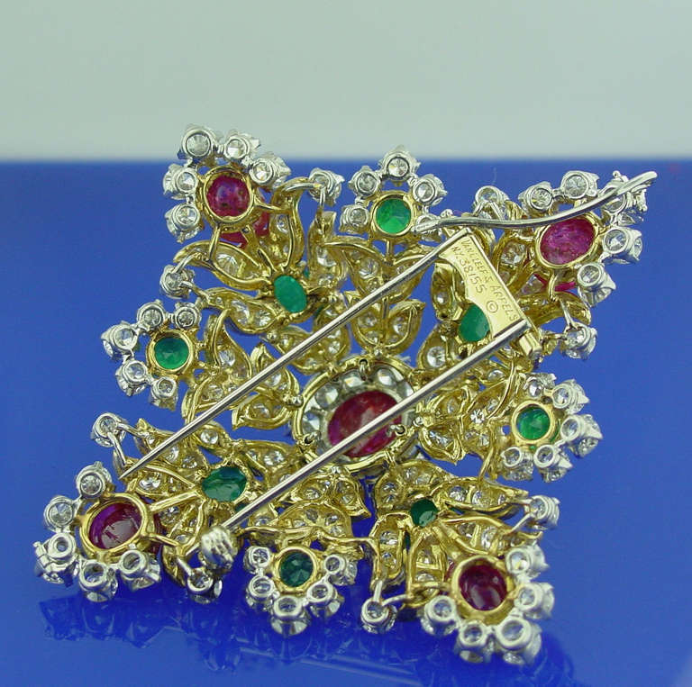 A  Ruby, Emerald and Diamond Brooch Mounted in 18 Karat Yellow Gold and Platinum by Van Cleef & Arpels. The brooch is set with approximately 12.20 carats of diamonds, 9.35 carats of rubies and 4.60 carats of emeralds.

Signed Van Cleef & Arpels