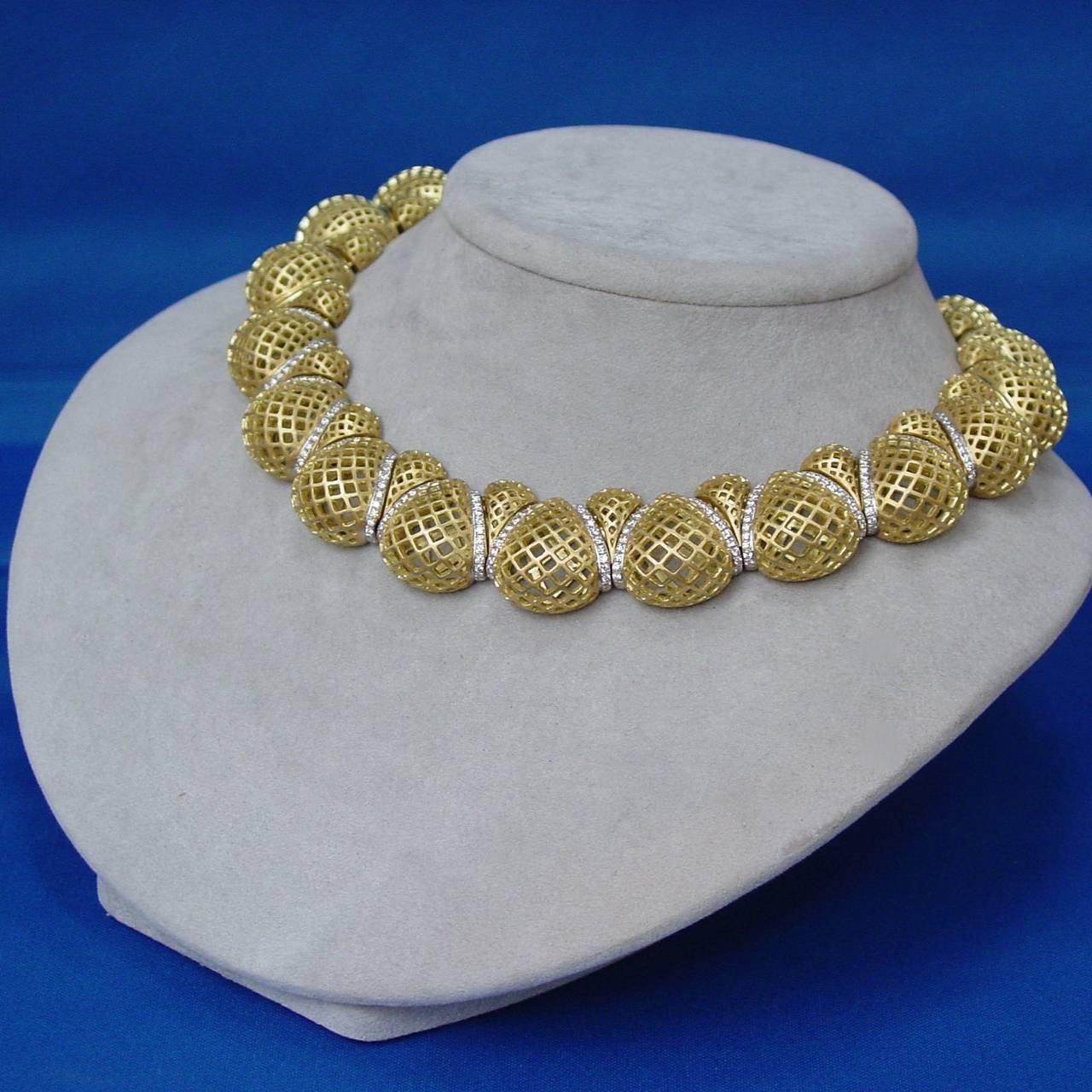 A beautifully made openwork 18 karat yellow gold and diamond necklace, bracelet and  earring suite by Lee Havens. The necklace and earrings are set with approximately 6.80 carats of round diamonds and the bracelet is set with approximately 2.50