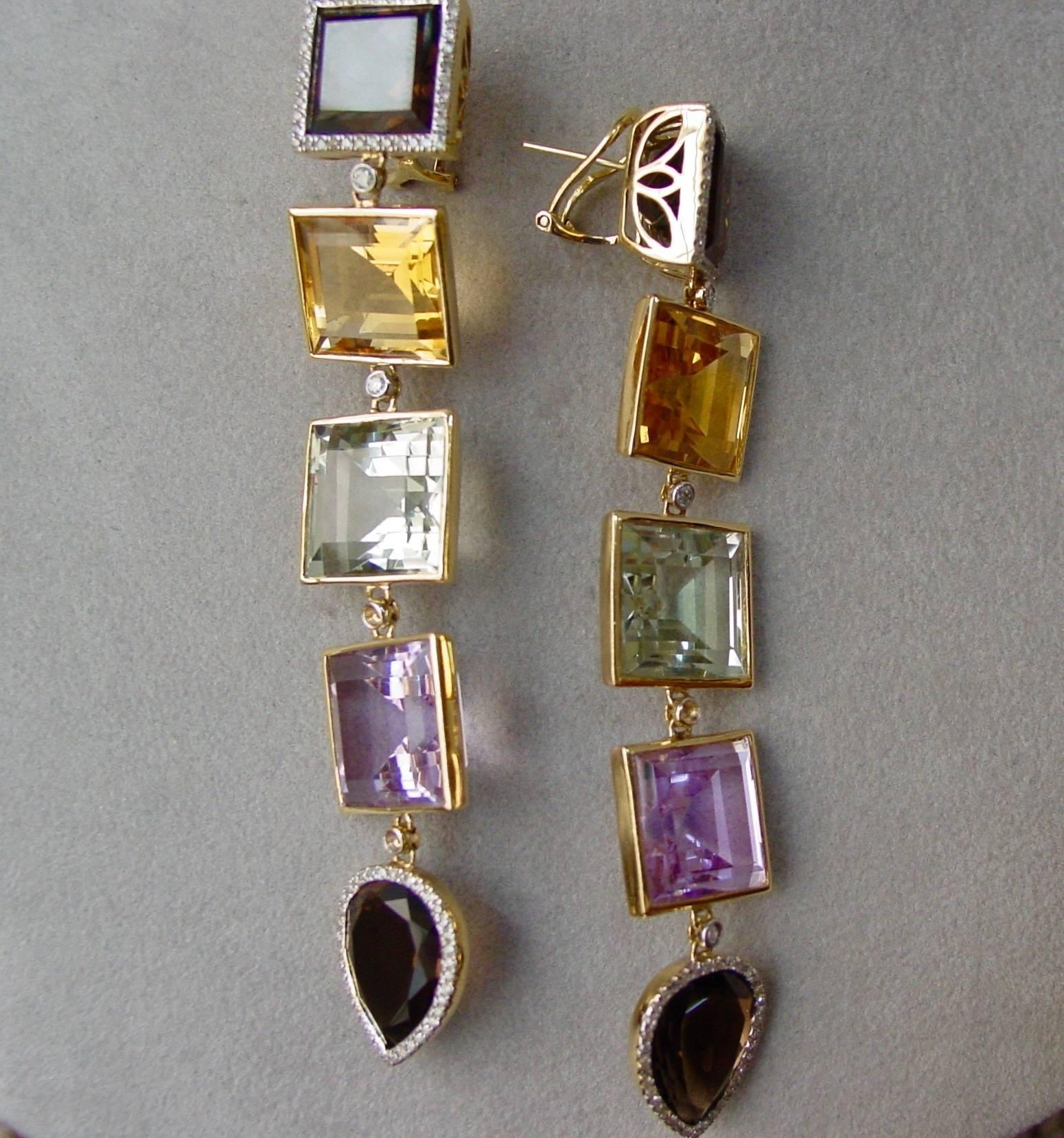 A very dangly and delightful pair of gemstone and diamond drop earrings mounted in 18 karat yellow gold. The 3 3/4