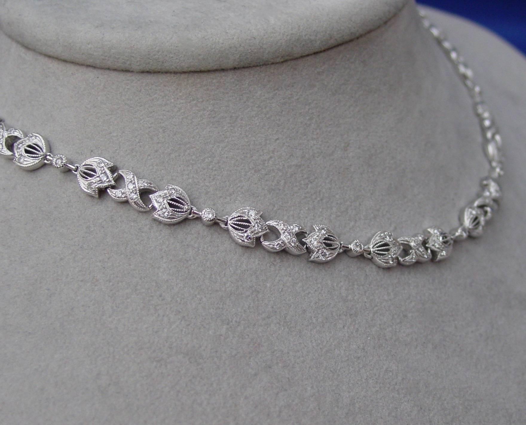 A platinum and diamond necklace featuring approximately 5.05 carats of round brilliant diamonds highlighted by delicate millgraining. Lovely.