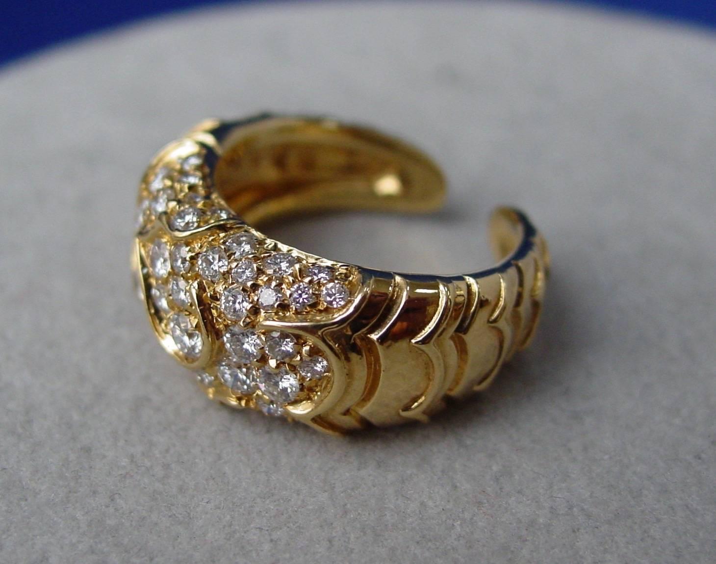 A Classic 18 Karat Yellow Gold and Pavé Onda Diamond Ring by Marina B. Set with approximately 1.50 carats of round brilliant diamonds. 