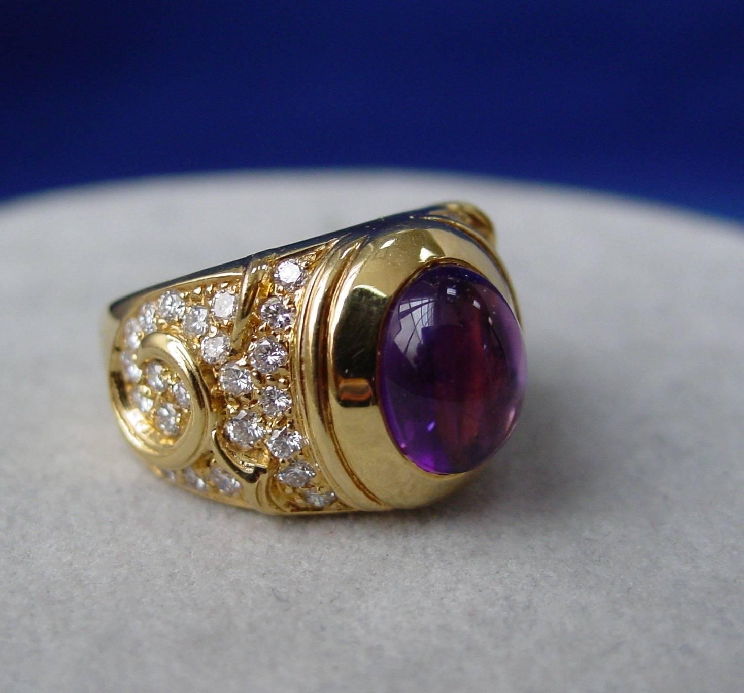 A  luscious cabochon amethyst and diamond "Lalli" ring by Marina B. The ring is mounted in 18 karat yellow gold and set with approximately 1.25 carats of round brilliant diamonds. The ring is stamped Marina B and numbered C3044.
