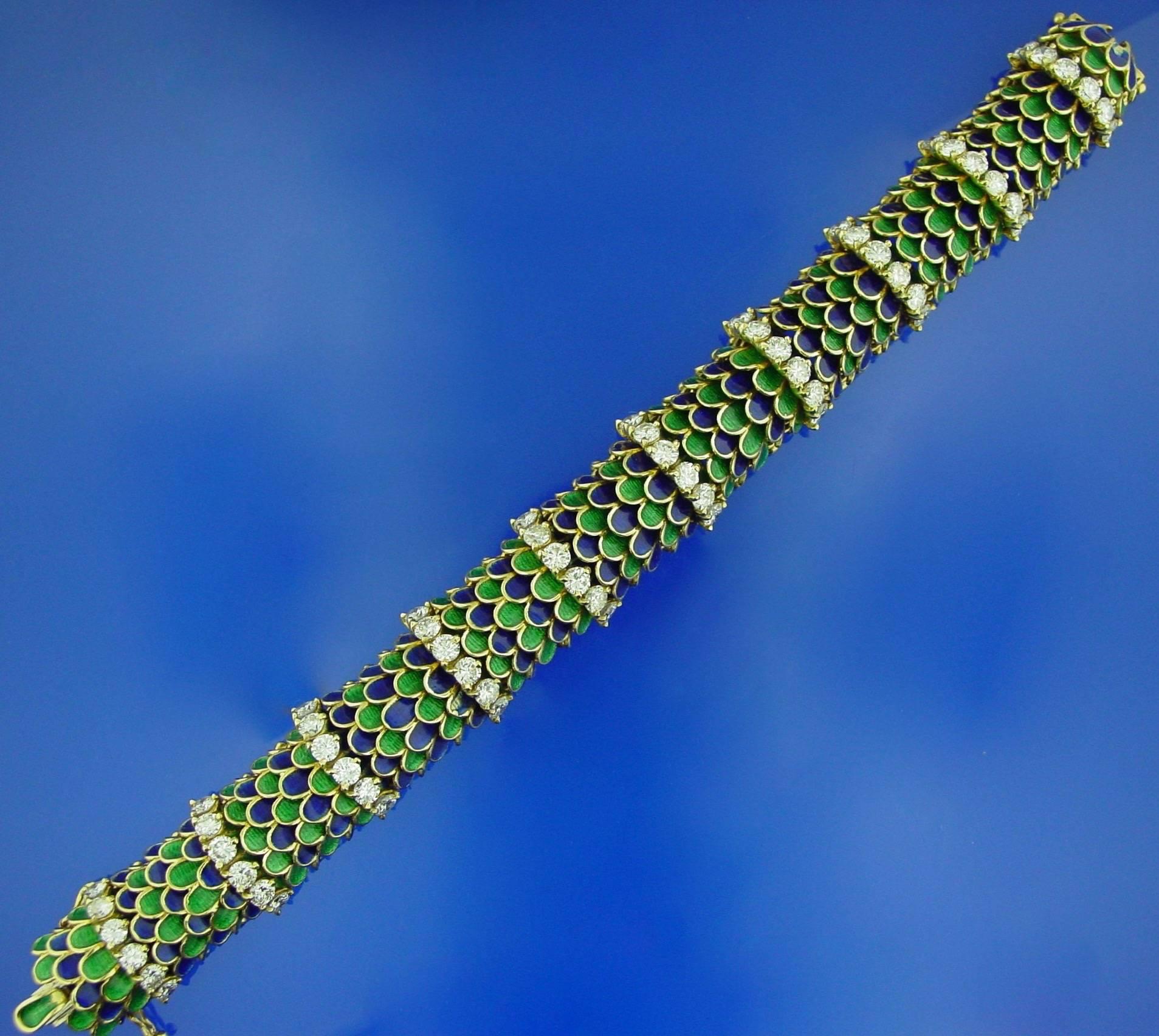 An 18 Karat Yellow Gold, Enamel and Diamond Bracelet. This beautiful bracelet of blue and green enameled scales is interspersed with rows of round brilliant diamonds adding a wonderful touch of color and sparkle to the wrist.  Numbered 28238 with