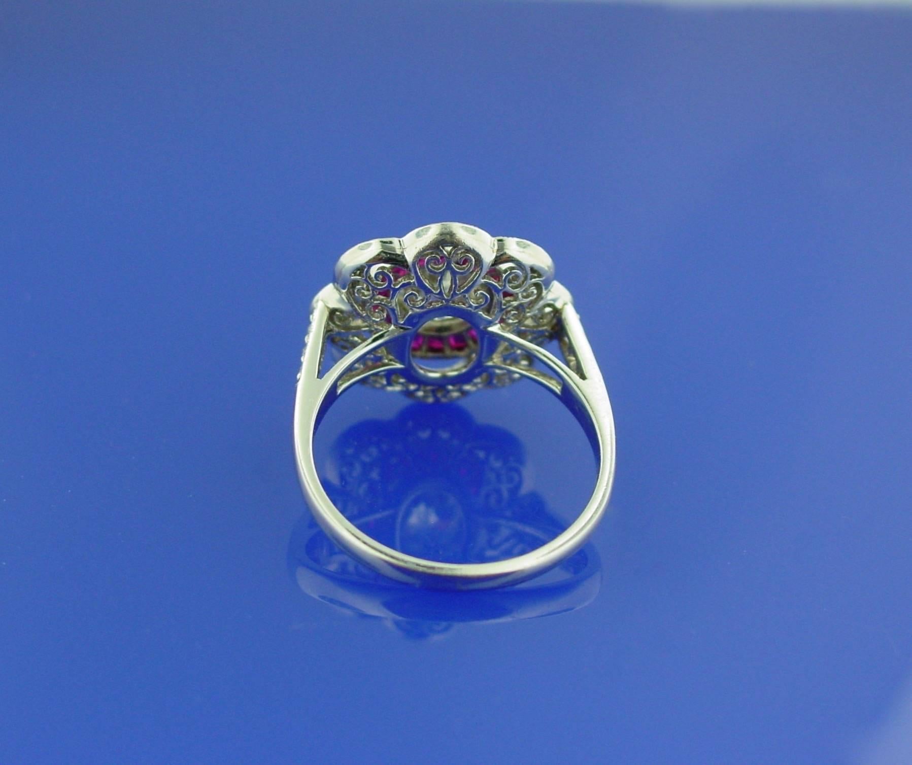 Beautifully combining both old and new, this ring features a European-cut diamond center in a detailed contemporary platinum mounting by Sophia D. The center diamond weighs 1.17 carats, and is approximately L-M in color and VS1-VS2 in clarity. The