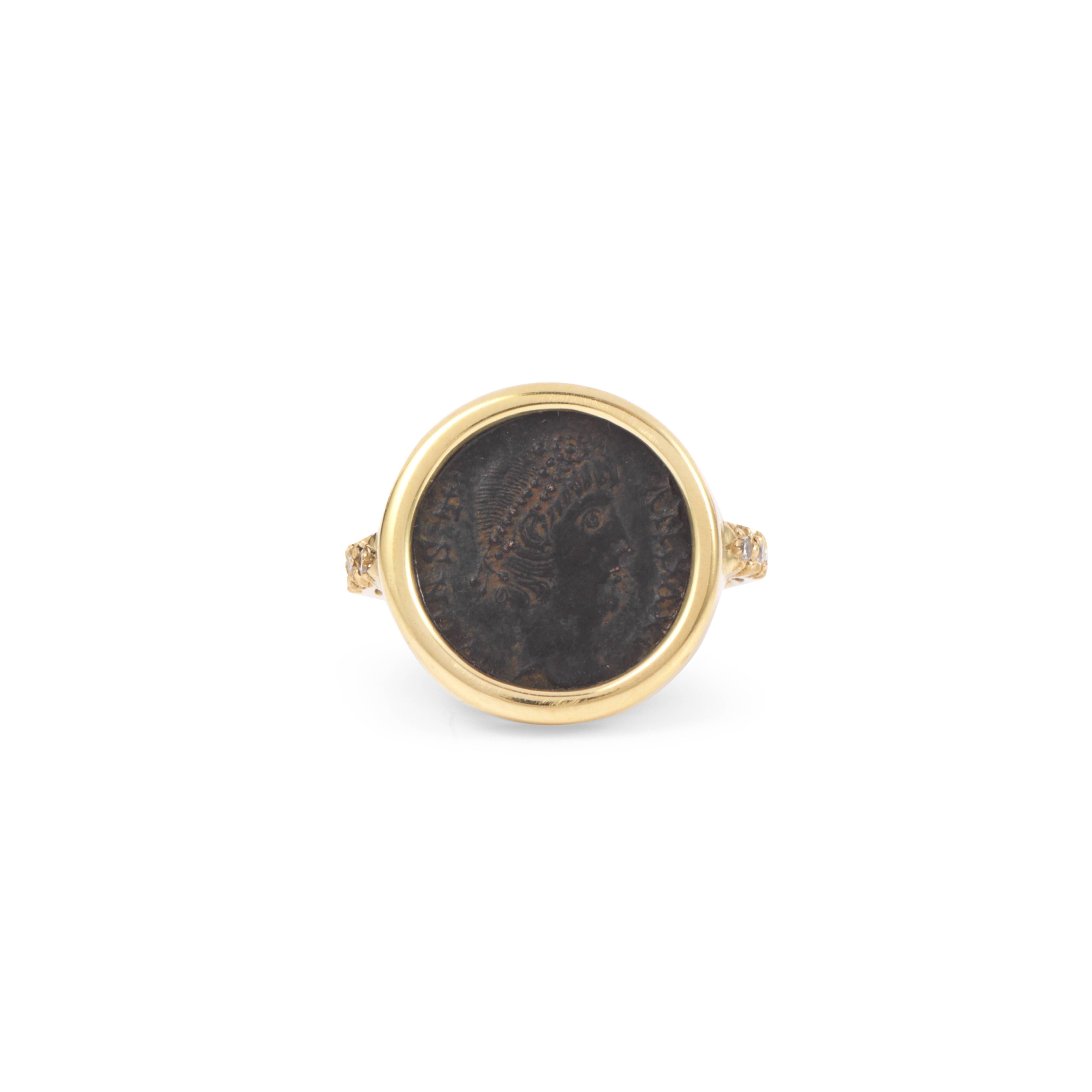This DUBINI coin ring from the 'Empires' collection features an authentic Roman bronze coin set in 18K yellow gold with diamonds.

Ring size available: 52 (US 6)

The ring may be resized with a lead time of 1 week.

* Due to the unique process of