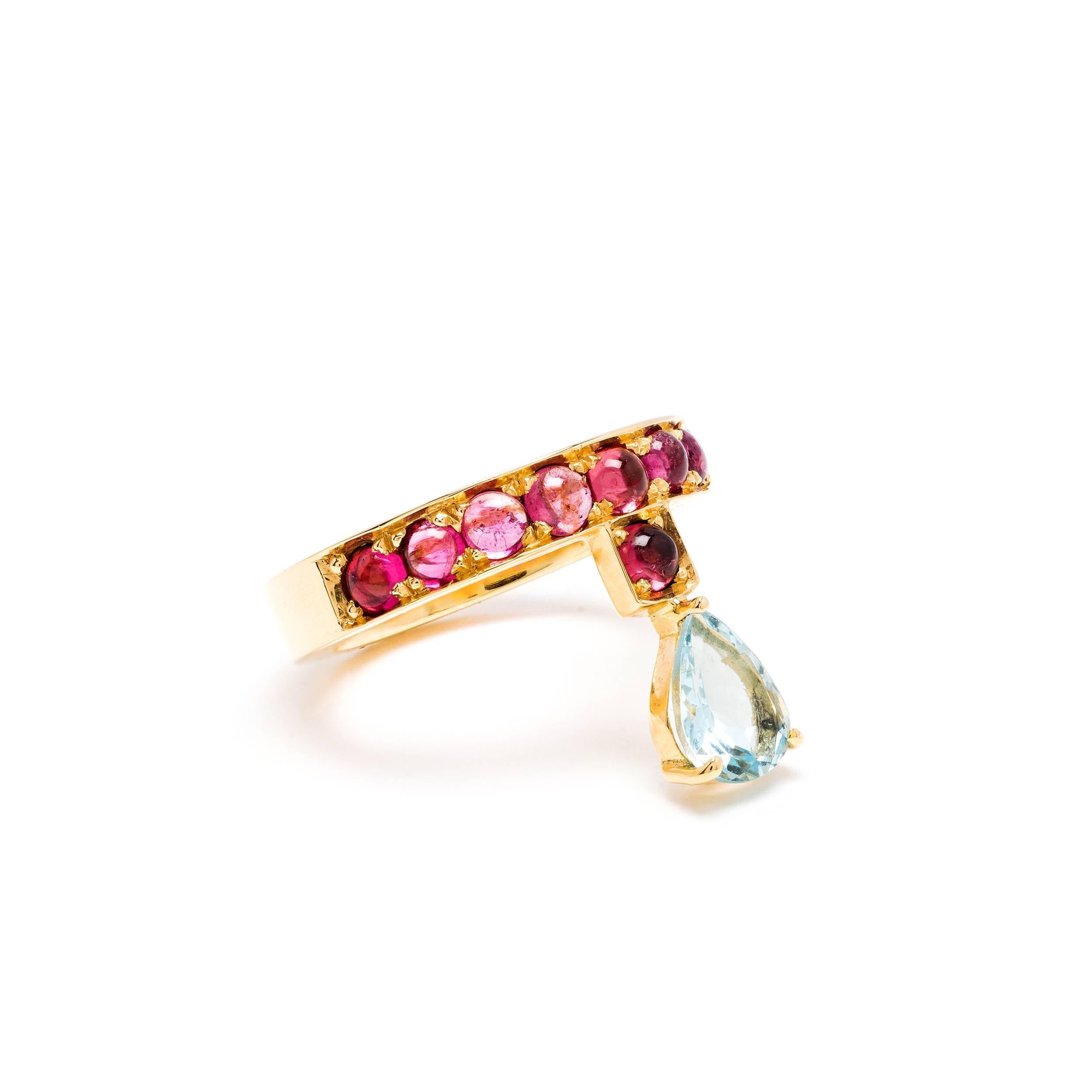 This DUBINI ring from the 'Theodora' collection features an aquamarine drop with rubellite tourmaline cabochons set in 18K yellow gold. 

Ring size available: 51 (US 5.75)

The ring may be ordered in any size with a lead time of 2-3 weeks.

Please