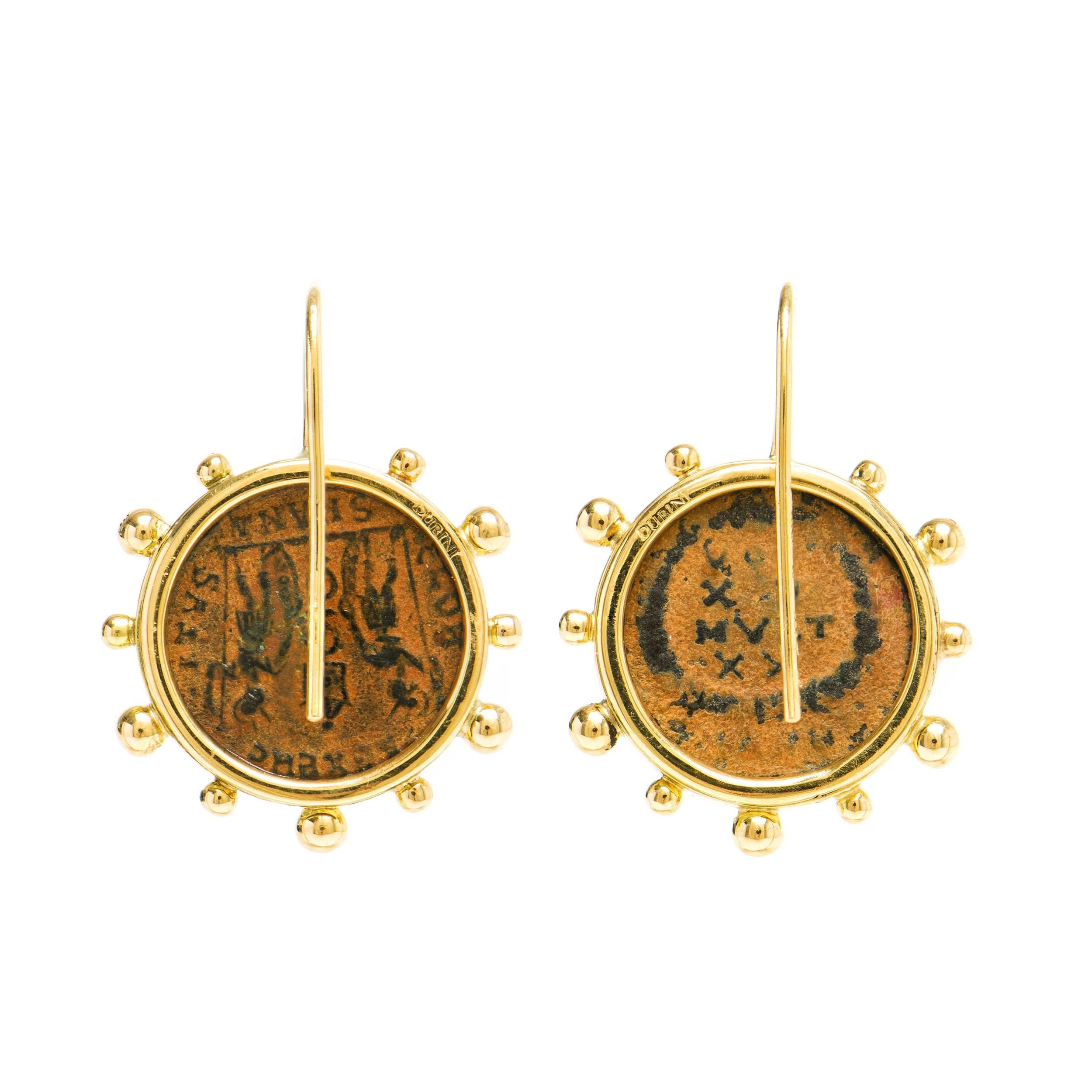 These Dubini coin earrings from the 'Empires' collection feature authentic Roman Imperial bronze coins set in 18K yellow gold.

ABOUT THE COINS

Patina is that beautiful and brilliant kind of time-created varnish, of a green or brownish colour,