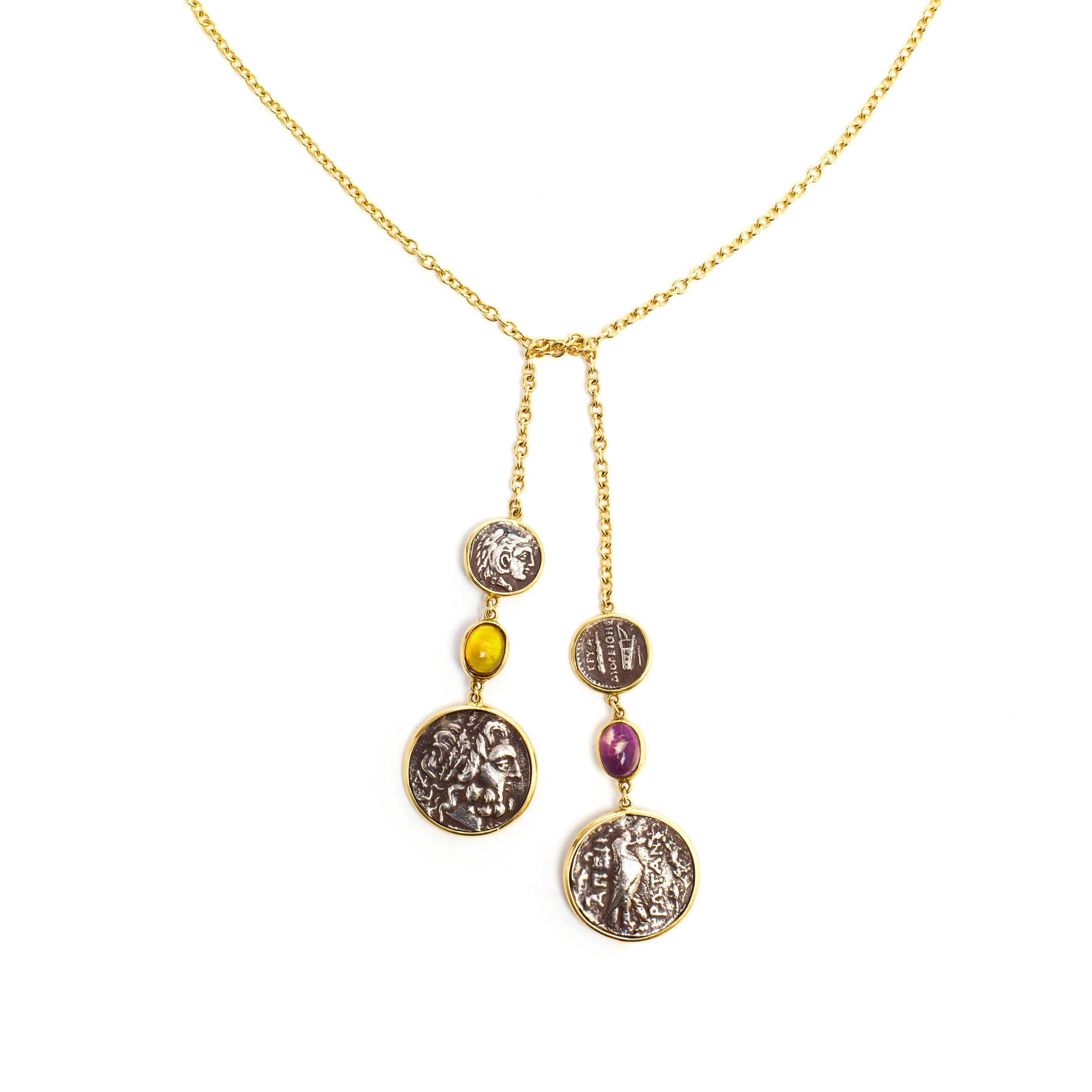 This DUBINI coin necklace from the 'Empires' collection features replica silver coins set with citrine and amethyst cabochons in 18K yellow gold.

Length of necklace: 87 cm
Chain : 76