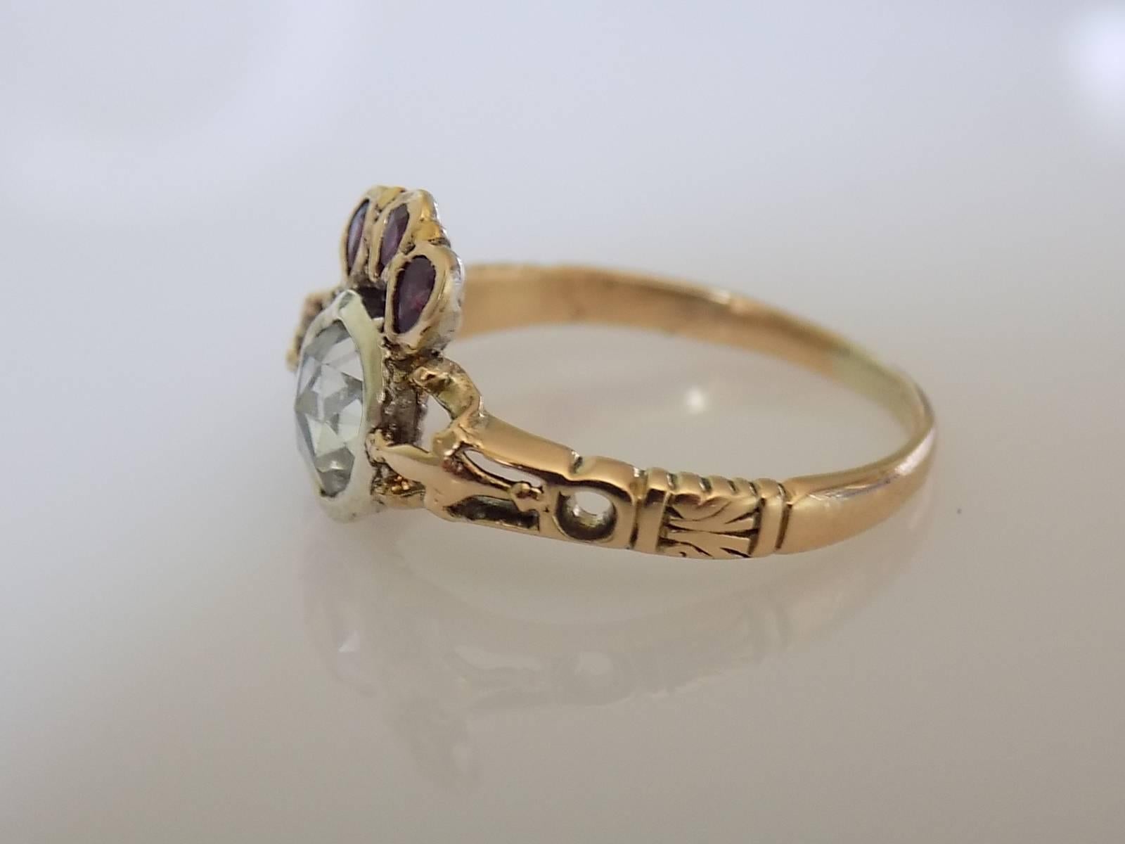 A Special Georgian c.1780s 18 carat Gold and Dutch Rose cut Diamond "Burning with Passion" ring. Diamond in Silver topped gold setting with a Ruby crown above. Each of this rings one of a kind and rare.

Crowned heart is symbol of Love